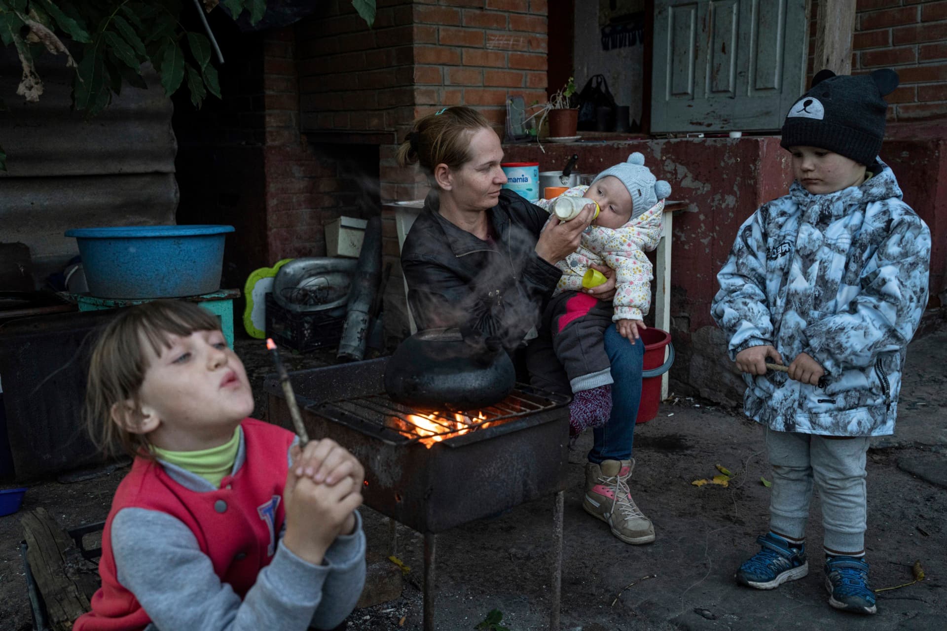 Margaryta Tkachenko feeds her 9-month-old daughter Sophia in the recently retaken town of Izium