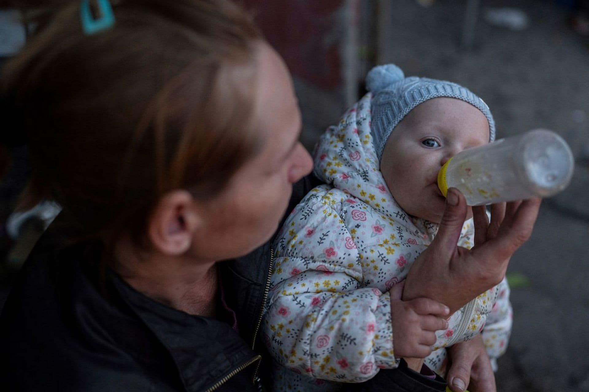 Margaryta Tkachenko feeds her 9-month-old daughter Sophia in the recently retaken town of Izium