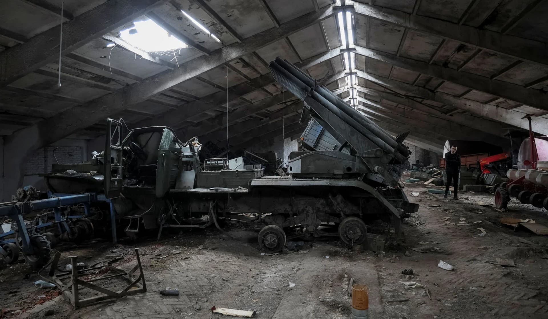 A destroyed Russian multiple rocket launch system inside a farm in the village of Nova Husarivka