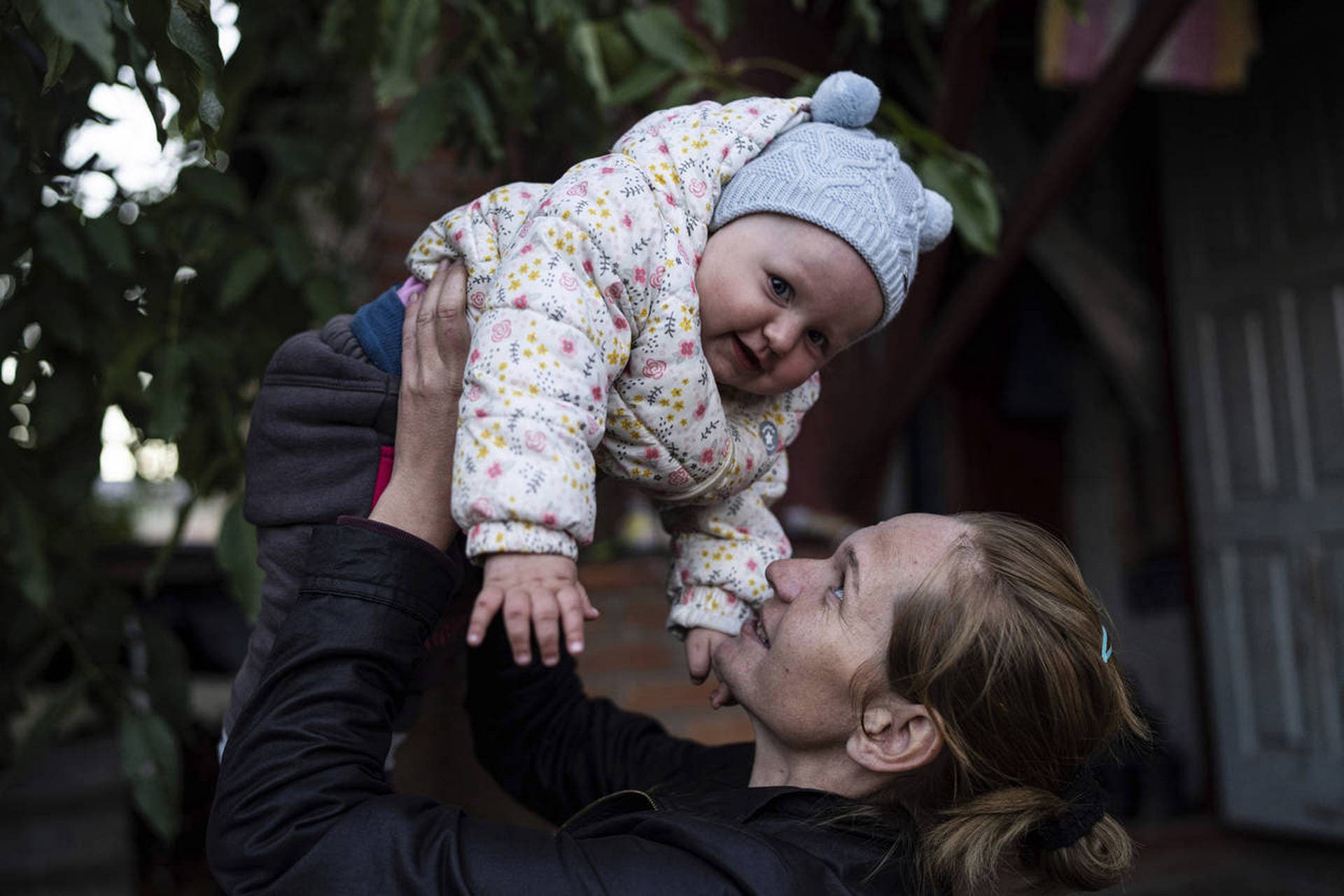 Margaryta Tkachenko plays with her 9-month-old daughter Sophia in the recently retaken town of Izium