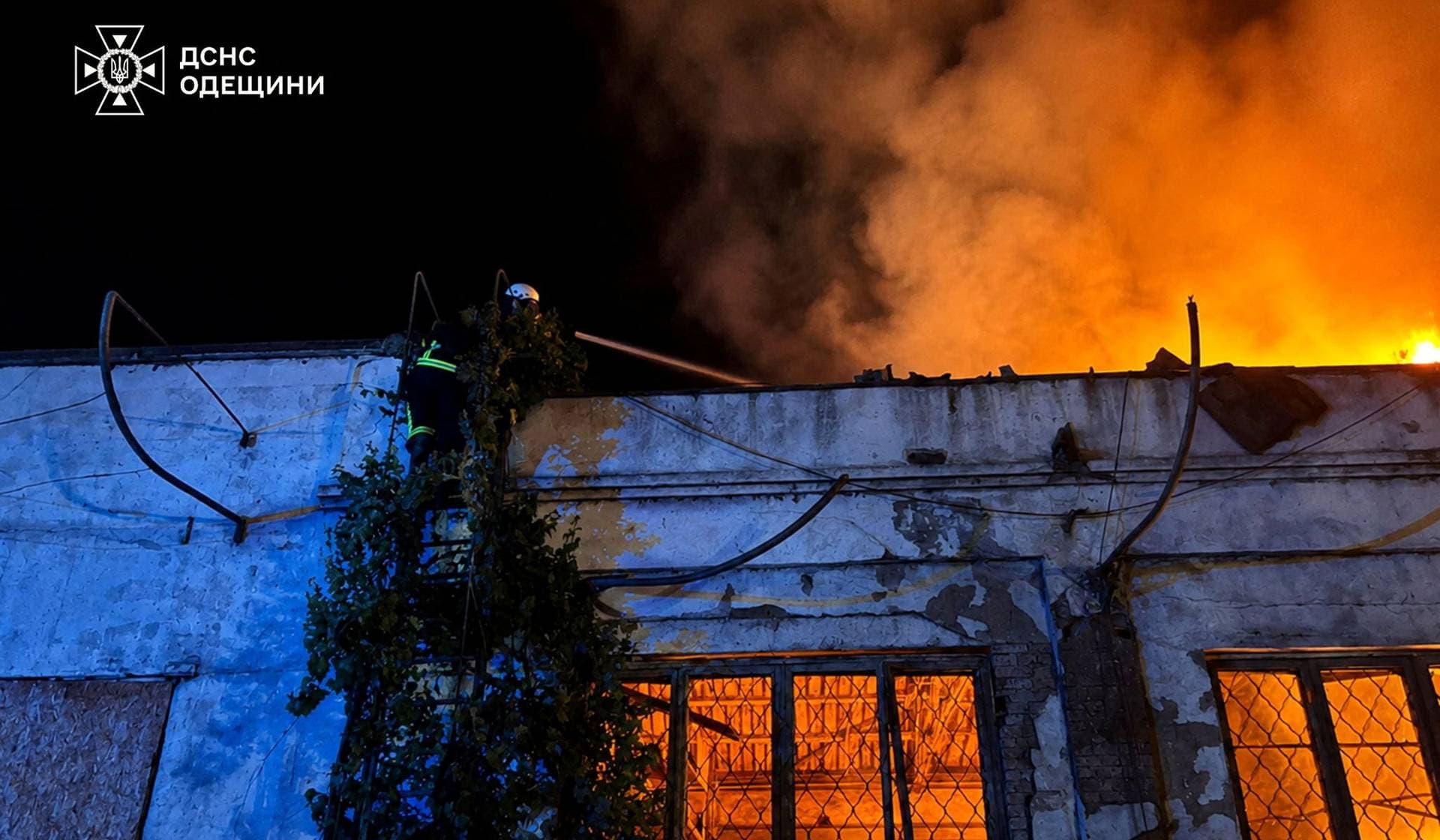 A firefighter works at a compound of a port which was hit during overnight Russian drone strikes in Izmail