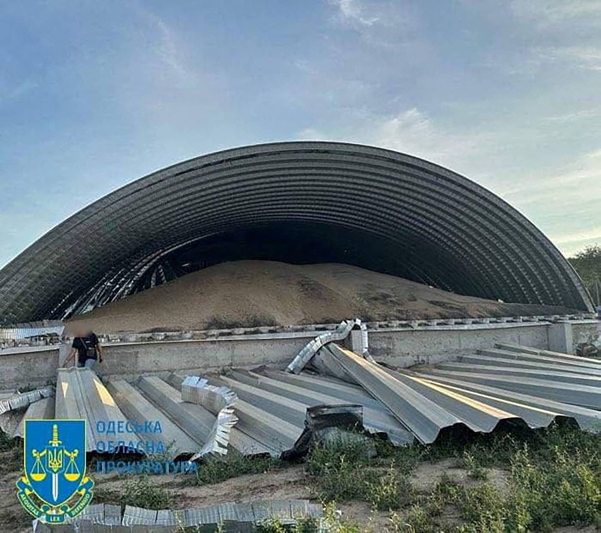 Damage is seen at a grain port facility after a reported attack by Russian military drones in the Odesa region