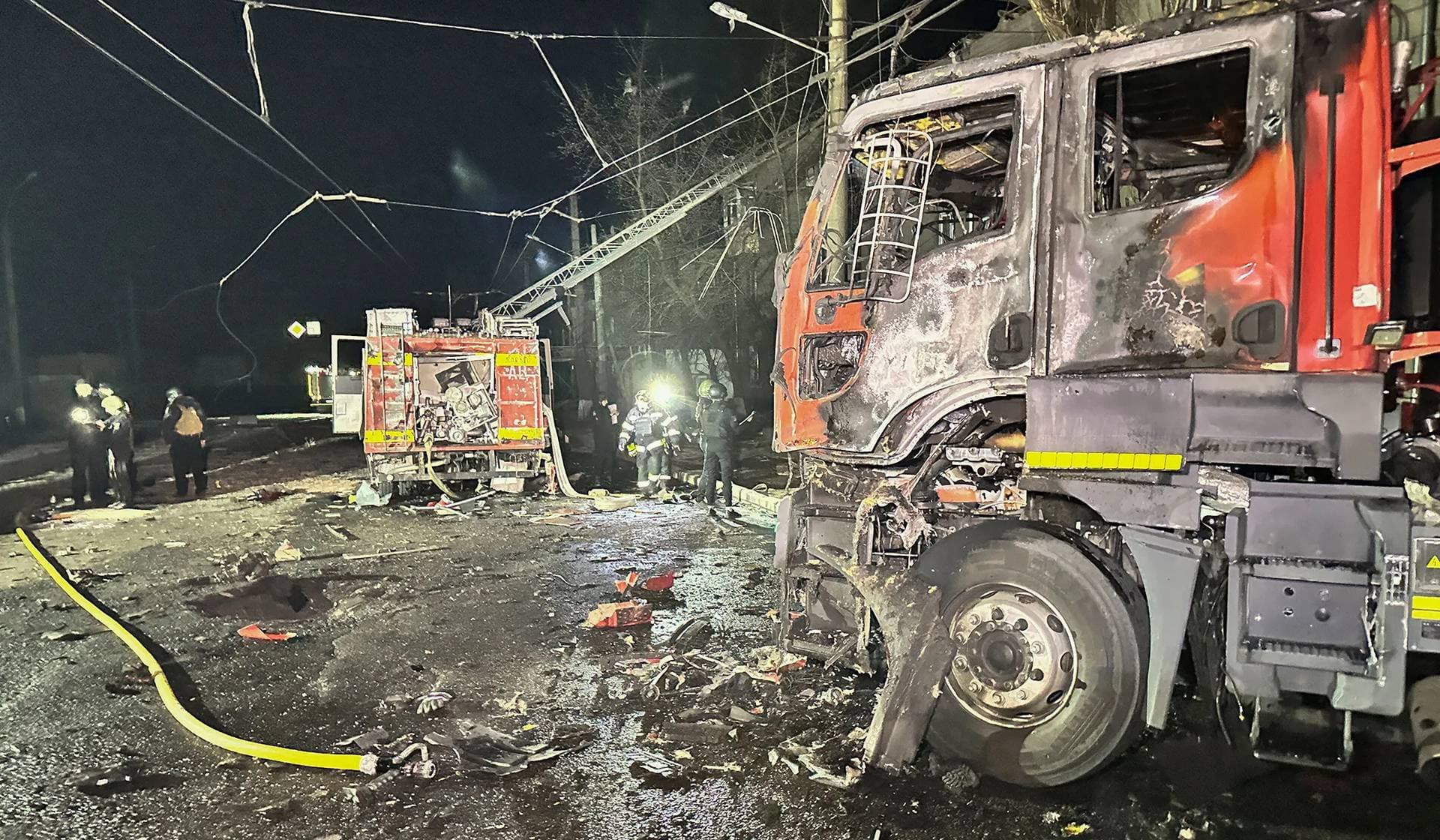 Damaged fire trucks at the site of a Russian drone strike in Kharkiv