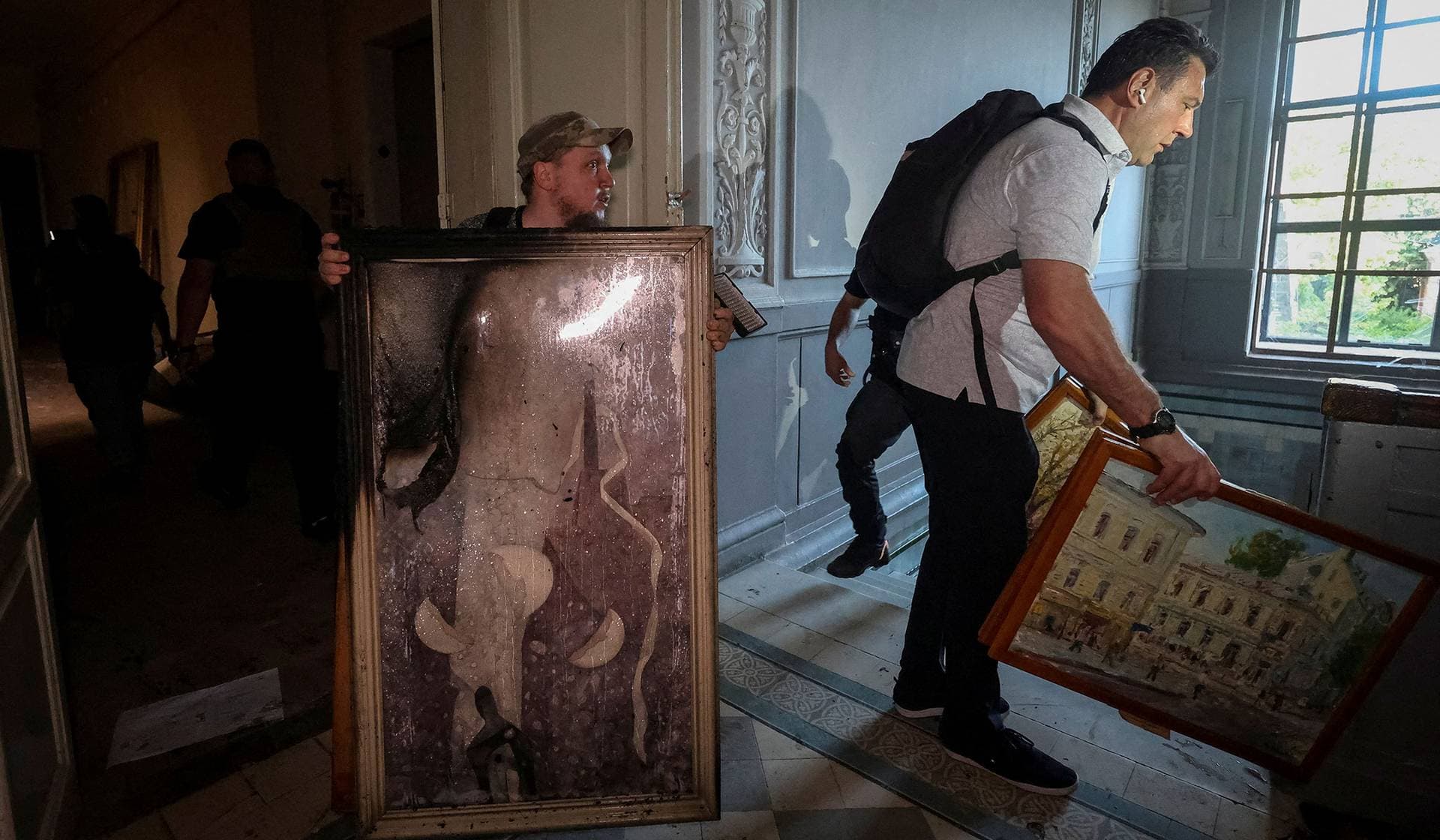 Volunteers rescue paintings from Kharkiv Art Museum, which was hit by a Russian drone strike in Kharkiv