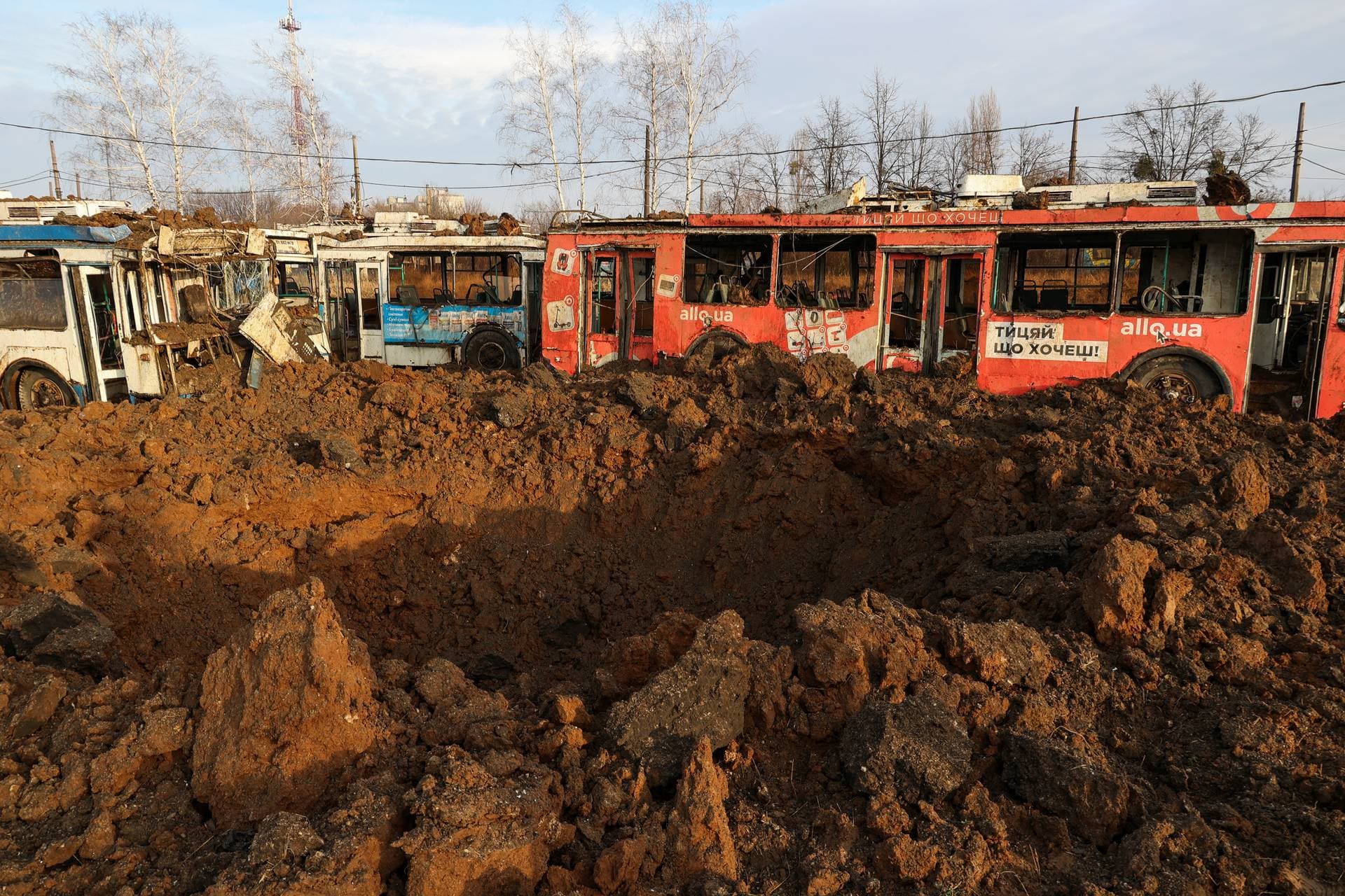 A crater is seen after a Russian missile strike at a compound of a public transport depot in Kharkiv