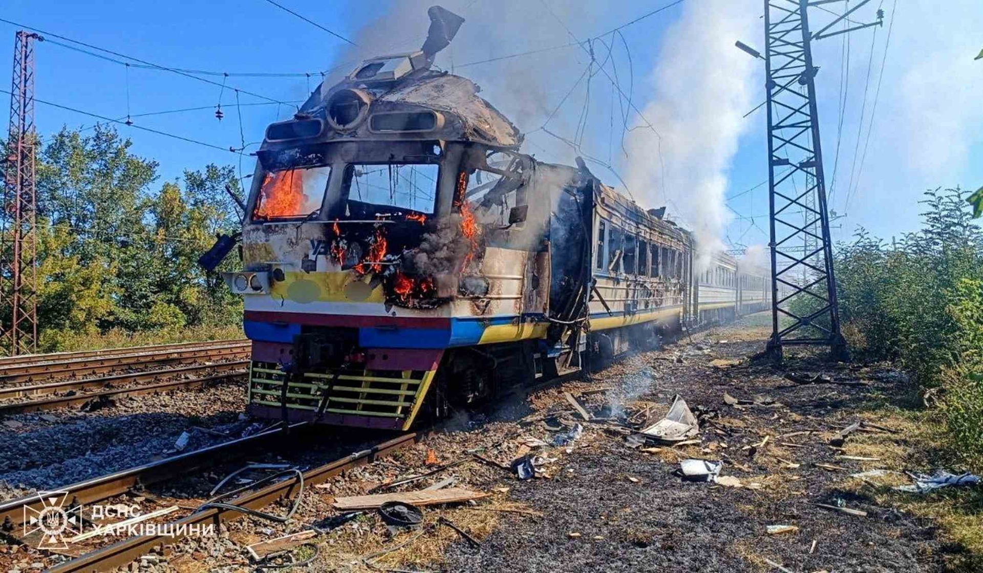 A passenger-train locomotive burns after a Russian drone strike in the Kharkiv region