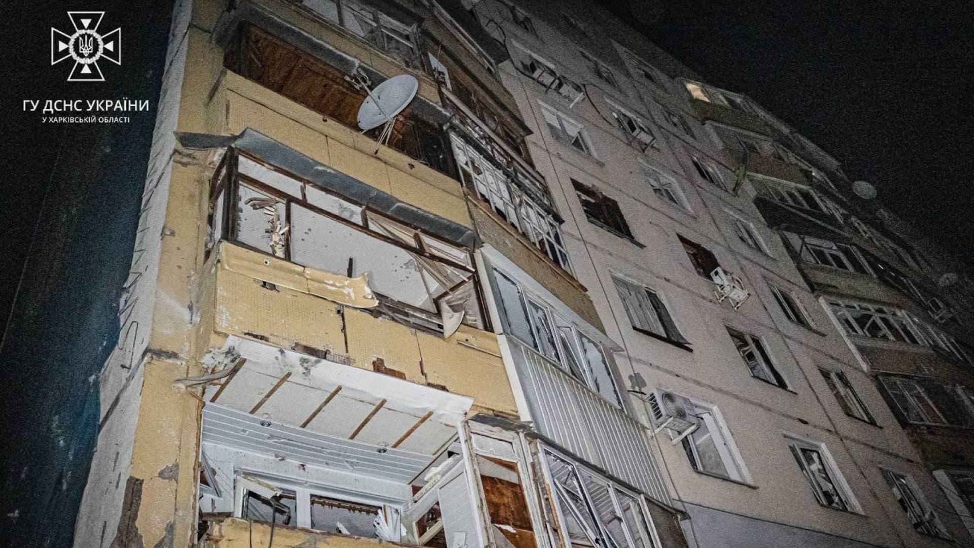 a damaged building in the aftermath of a drone attack in Kharkiv