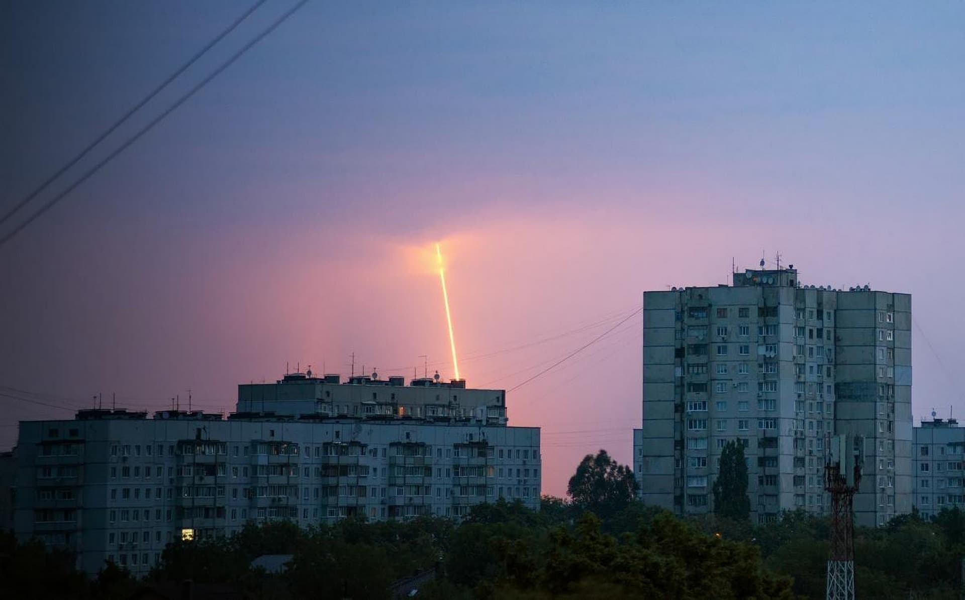 A Russian rocket launched toward Ukraine from Russia's Belgorod region is seen at dawn in Kharkiv