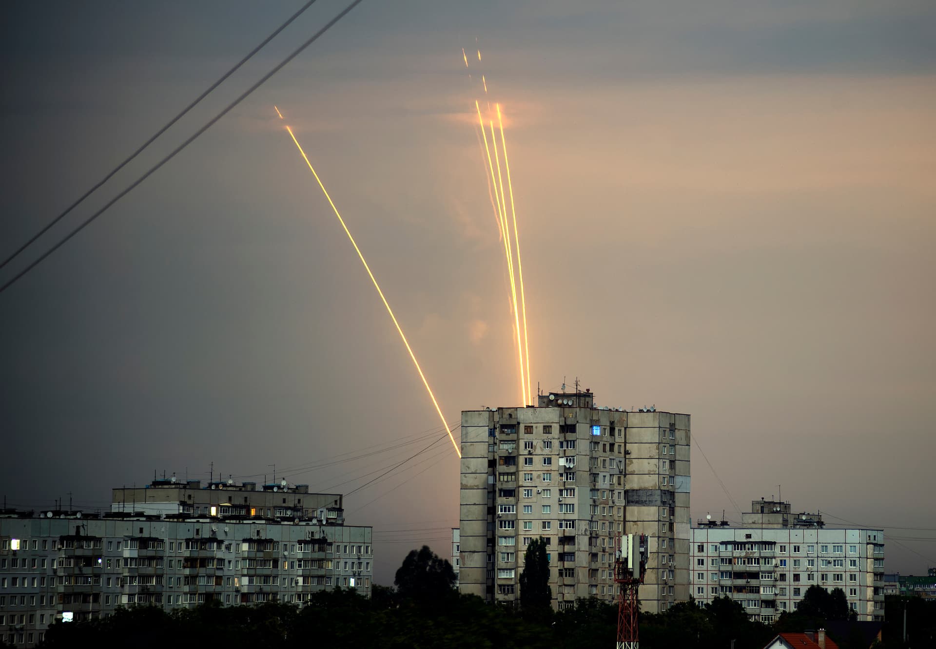 Russian rockets launched against Ukraine from Russia's Belgorod region are seen at dawn in Kharkiv