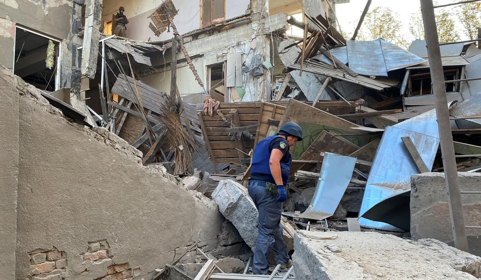 A member of the State Emergency Service works at a site of a building of the Kharkiv National Technical University heavily damaged by a Russian missile strike in Kharkiv