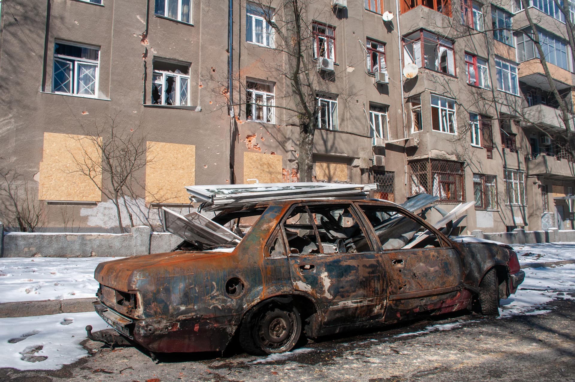 A car destroyed after an explosion in Kharkiv