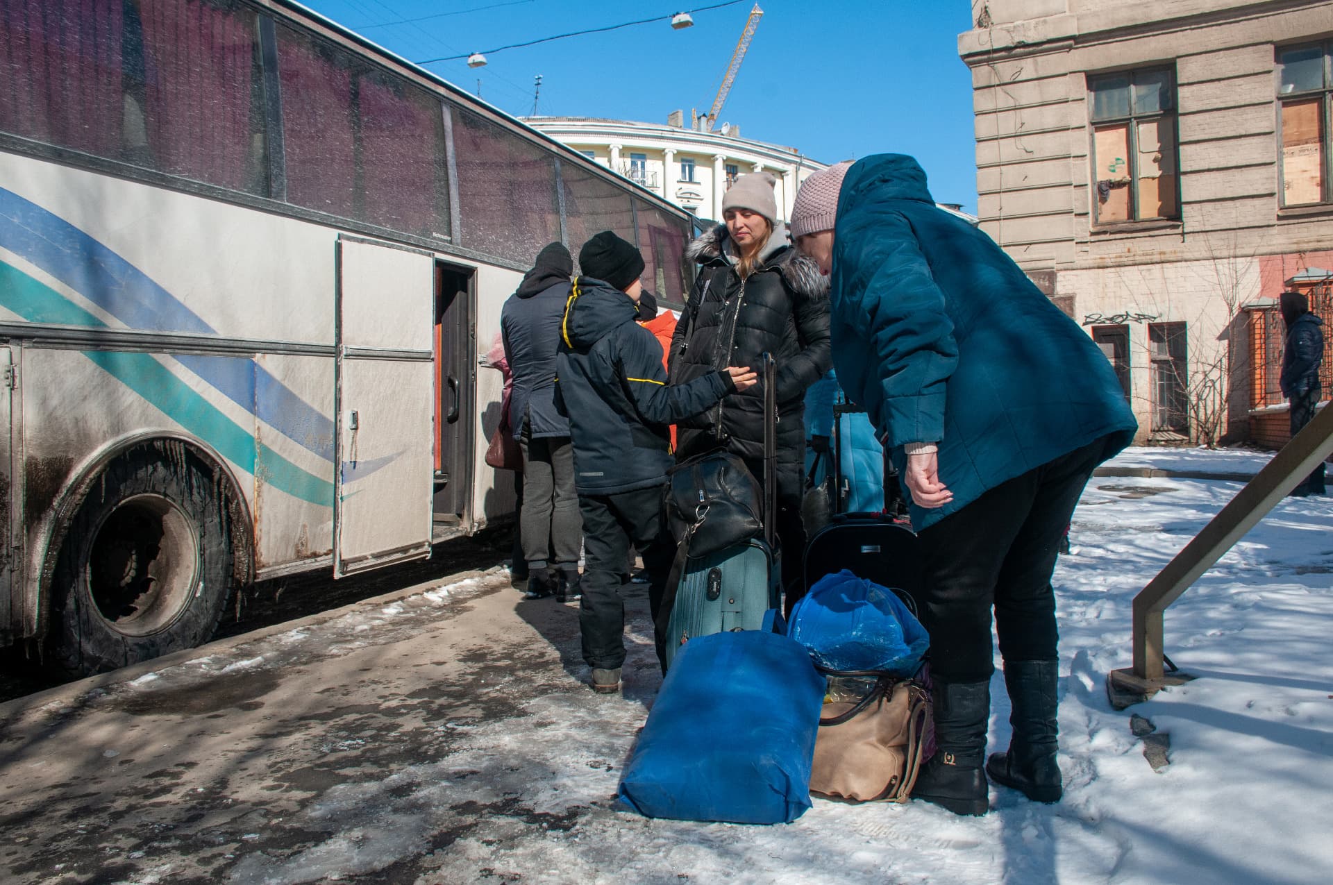 People get into the evacuation bus in Kharkiv
