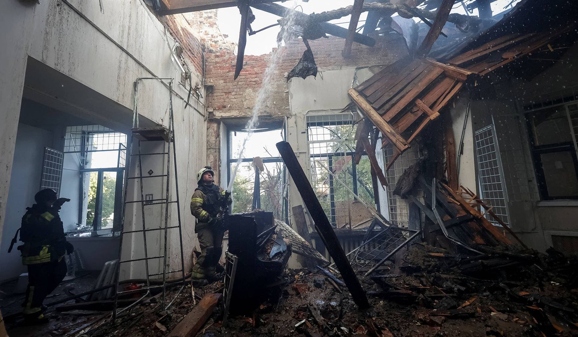 Firefighters work in Kharkiv Art Museum, which was hit by a Russian drone strike, in Kharkiv