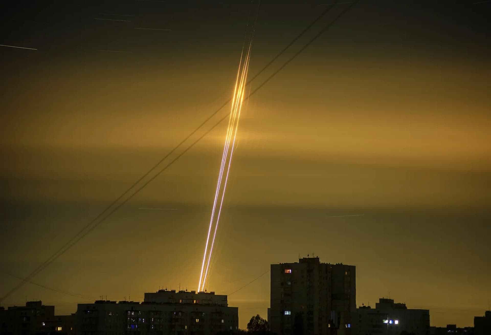 Russian rockets launched against Ukraine from Russia's Belgorod region are seen at dawn in Kharkiv