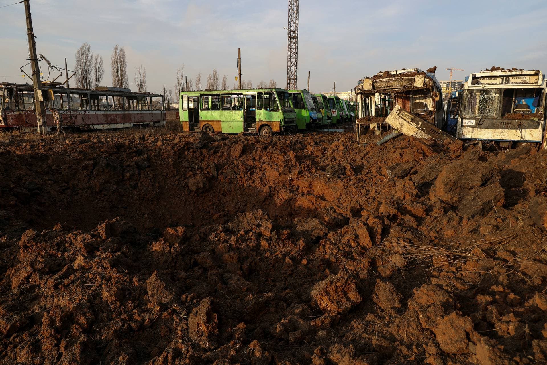 A crater is seen after a Russian missile strike at a compound of a public transport depot in Kharkiv