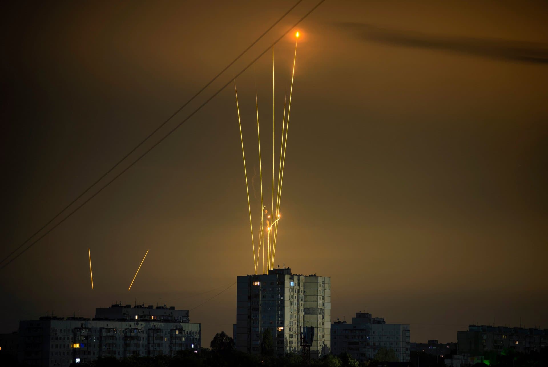Russian rockets launch against Ukraine from Russia's Belgorod region are seen at dawn in Kharkiv