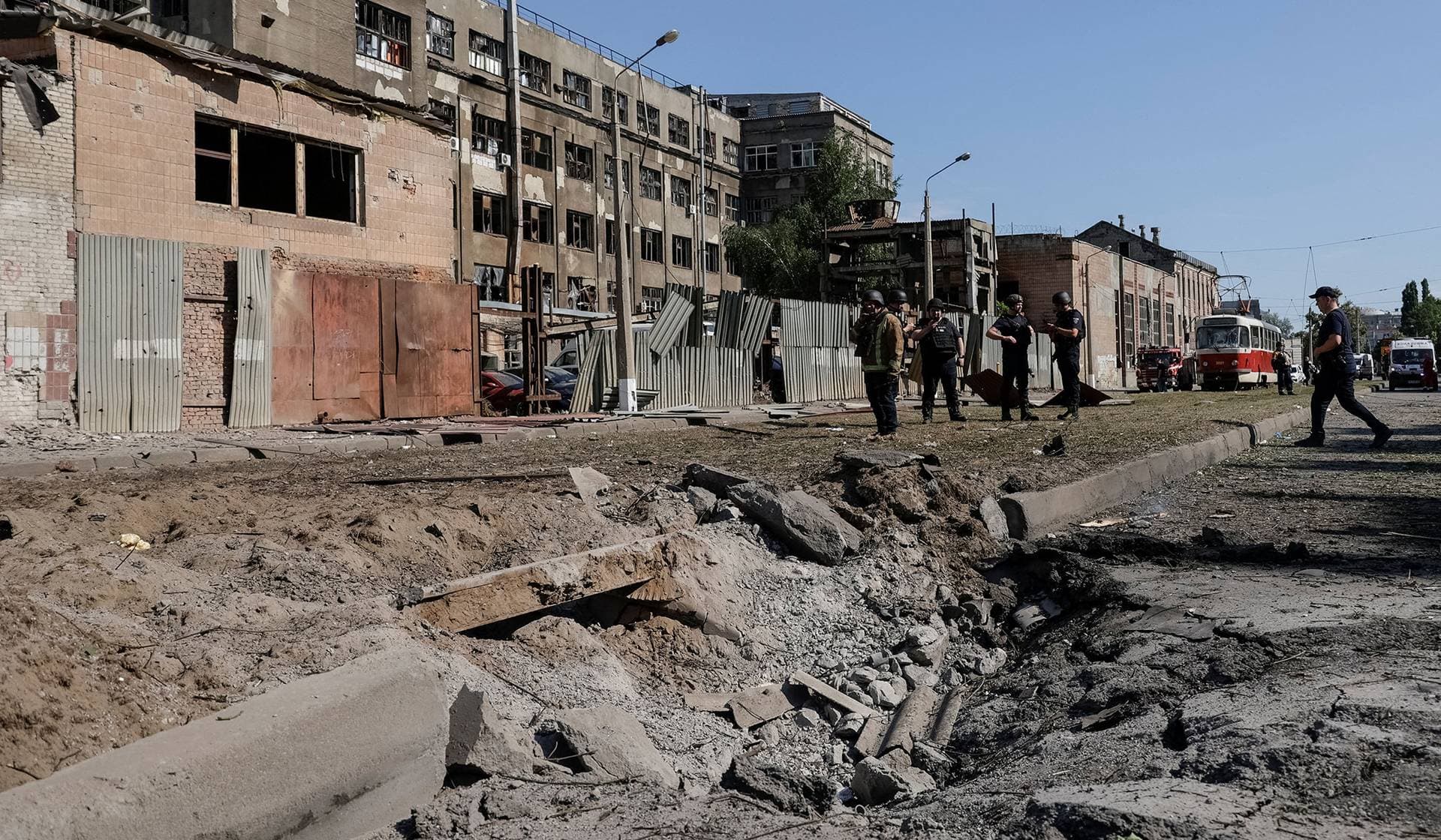 Police officers work at the site of a Russian air strike in Kharkiv