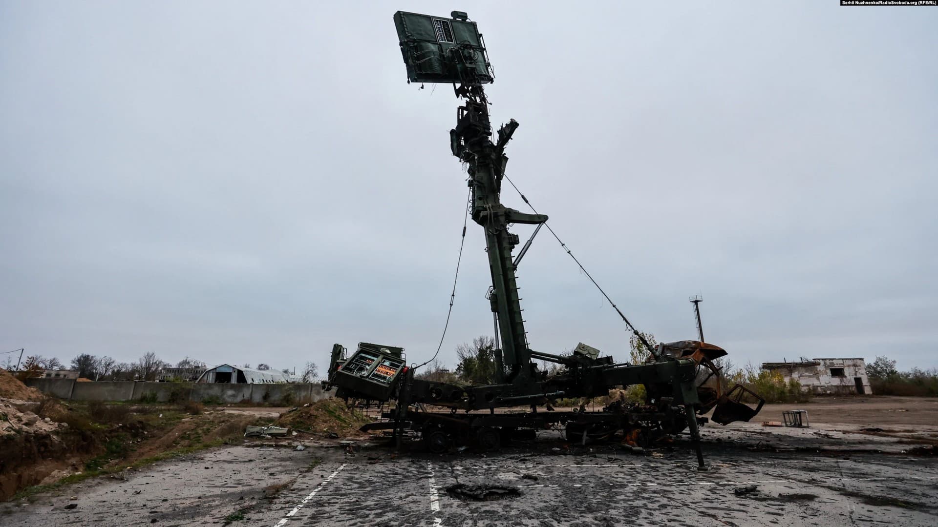 A destroyed Podlet radar system next to the crater of a large explosion at the airport in Kherson