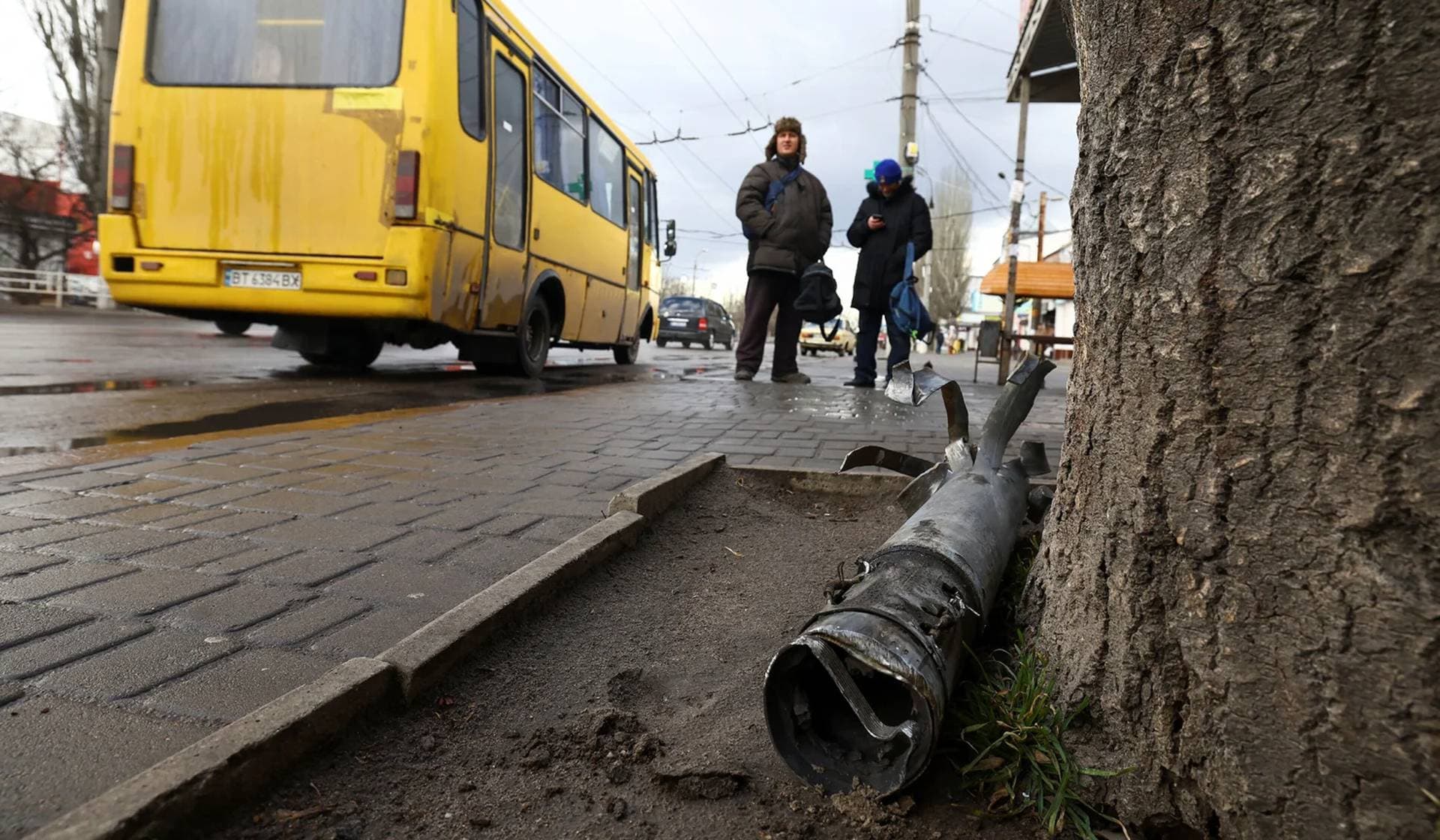 A part of a rocket in front of a bus station damaged after shelling in Kherson