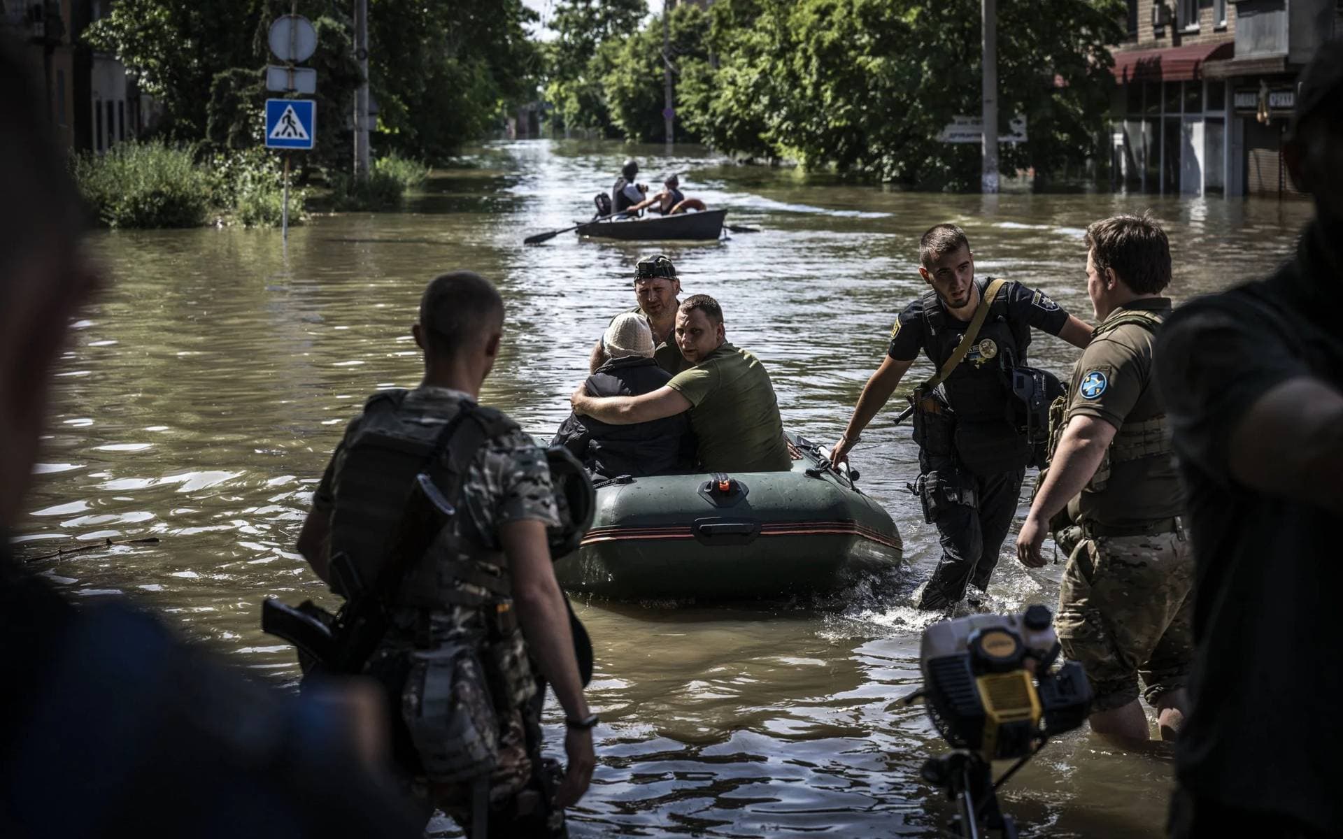 People are evacuated from flooded areas in Kherson