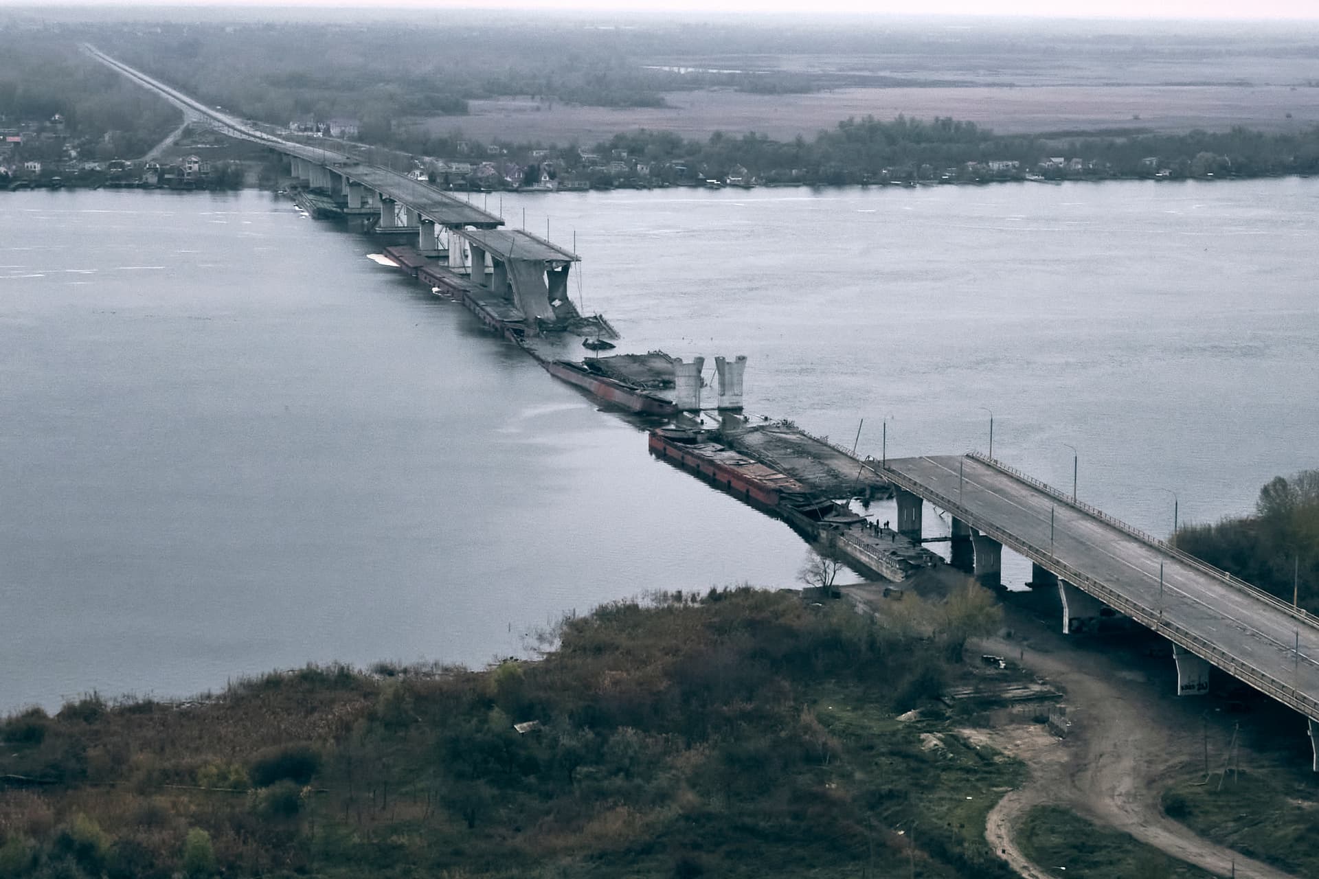 A view of the damaged Antonovsky bridge over the Dnieper river in Kherson