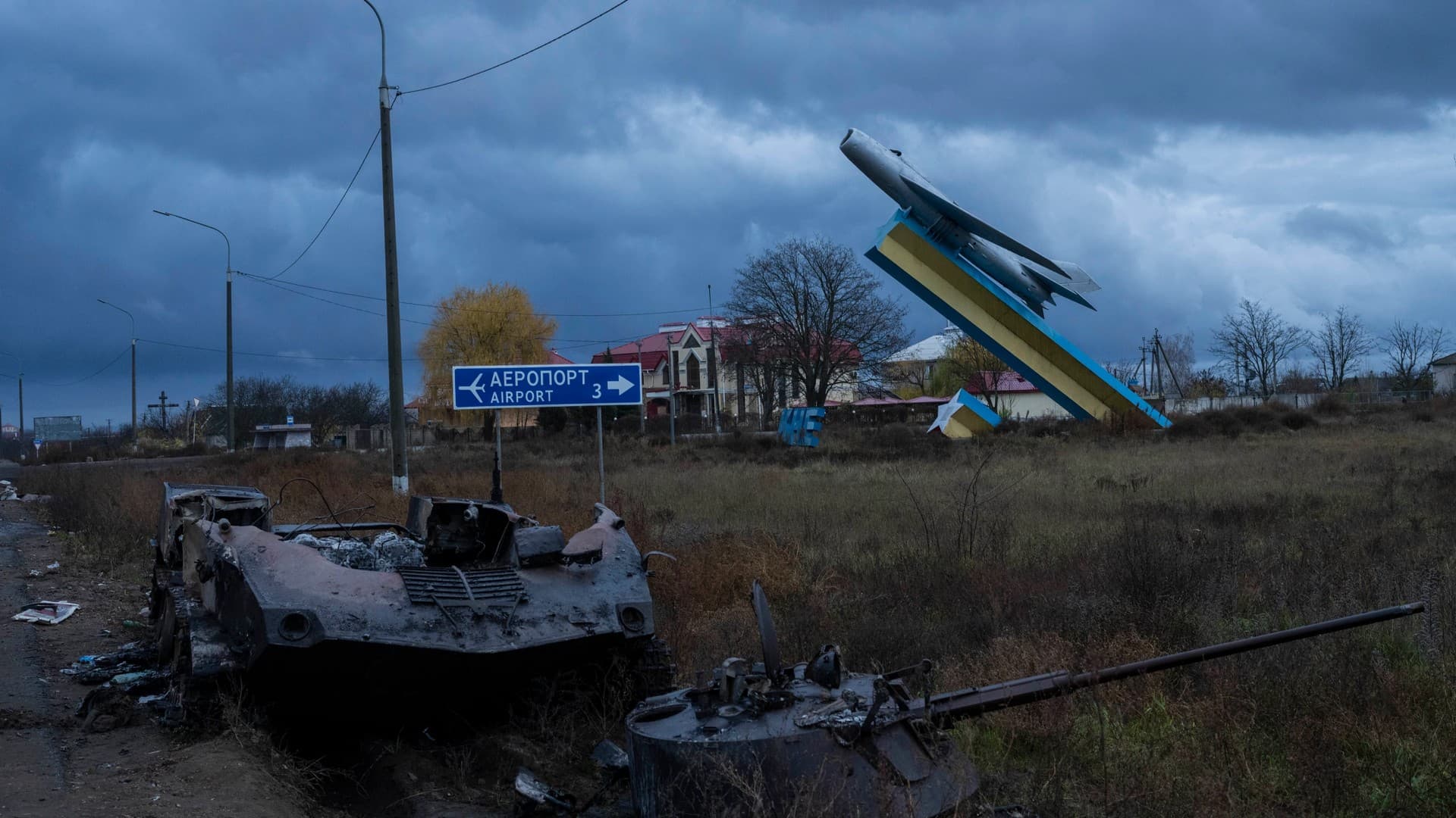 A destroyed armoured vehicle lies at the entrance of Kherson