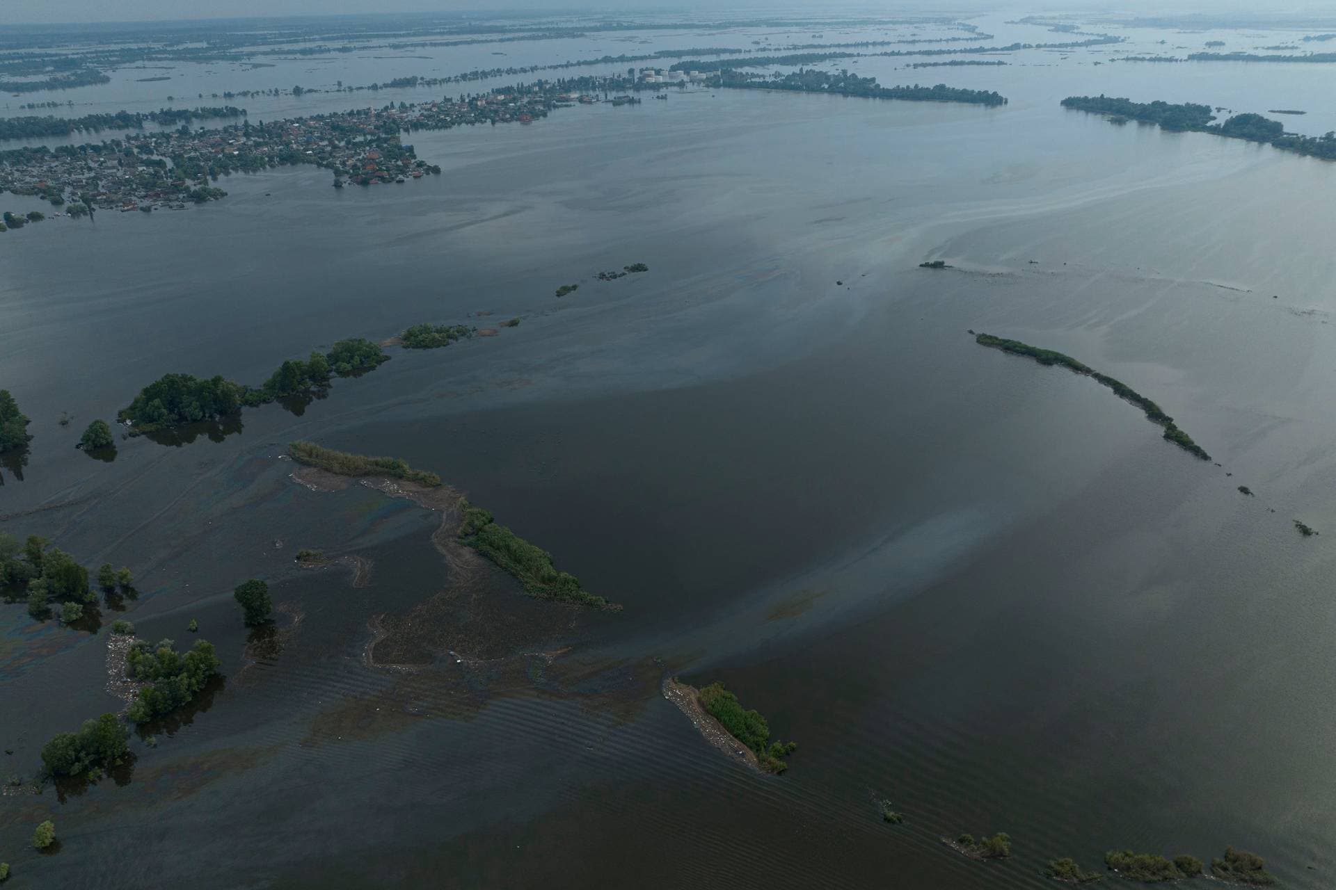 Pollution by oil is seen in Dnipro river in the flooded Kherson