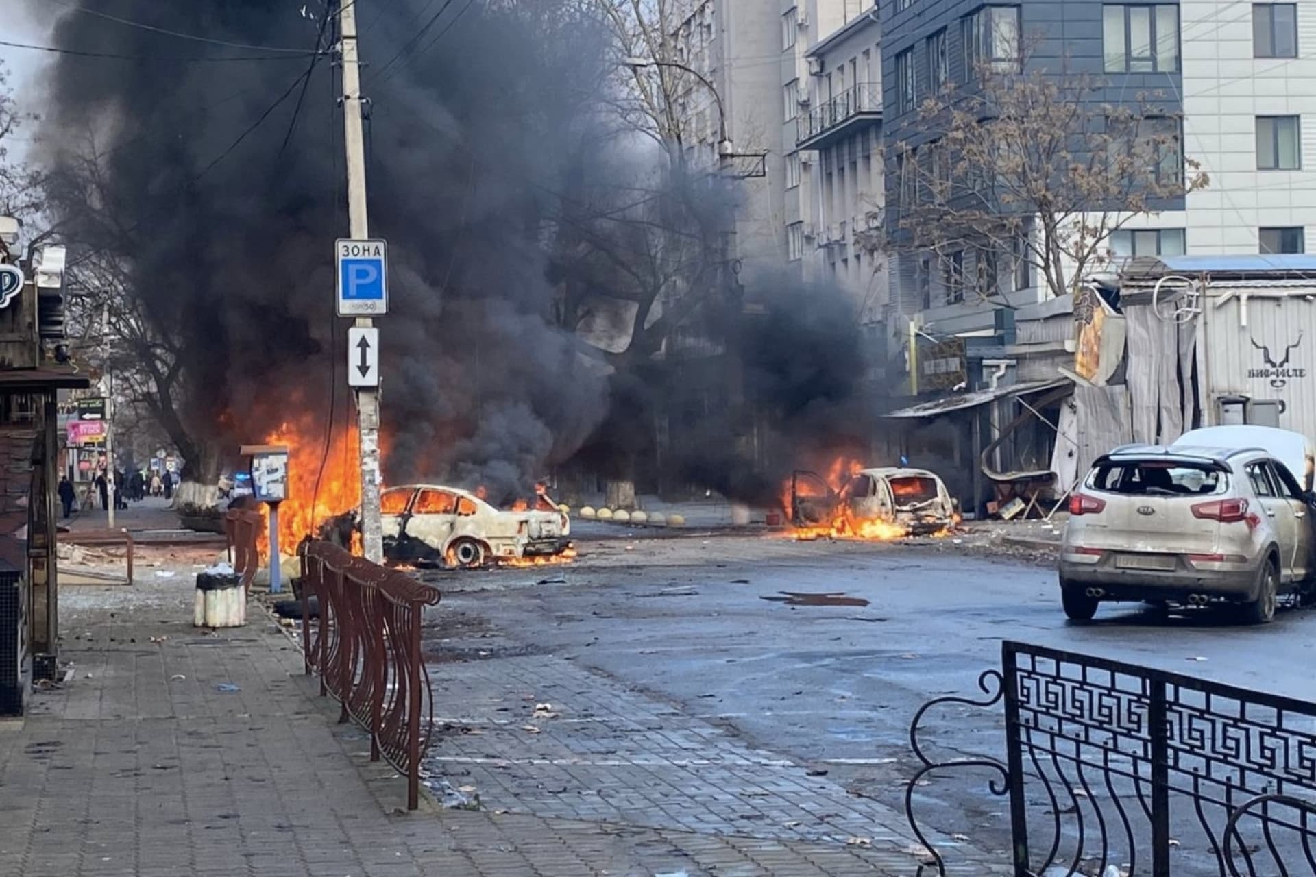 Cars burn on a street after Russian missile strikes on the Ukrainian port city of Kherson