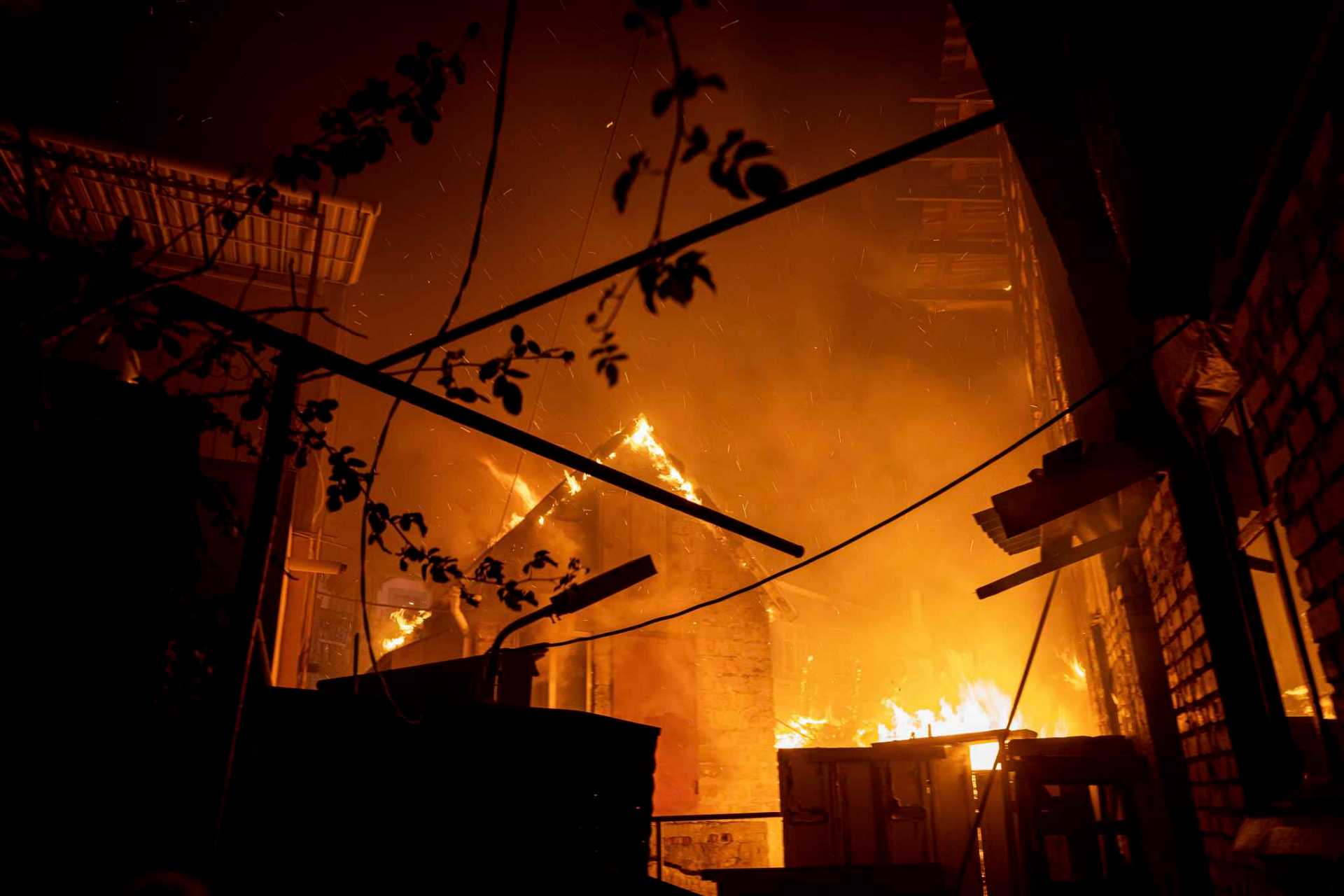 A house burns after a Russian attack in Kherson