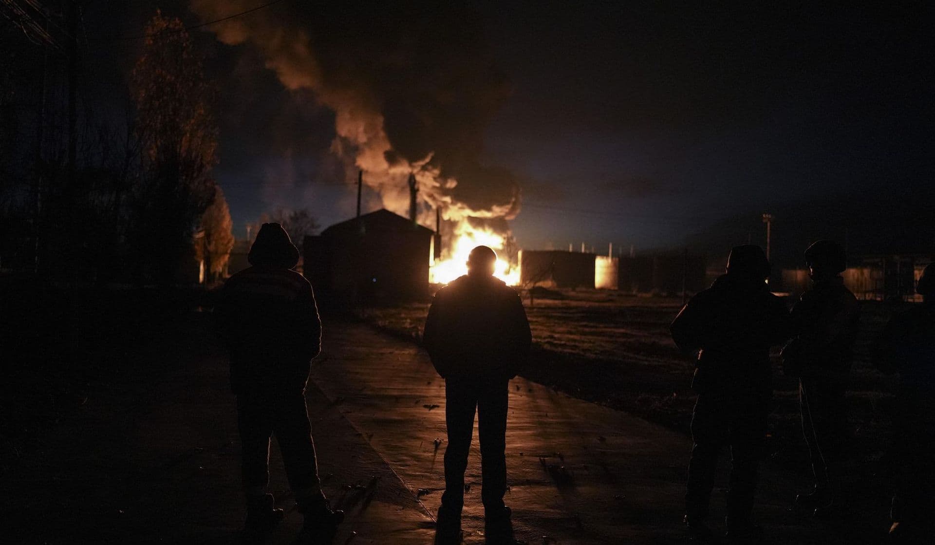 A plume of smoke rises during a fire caused by a Russian airstrike in Kherson