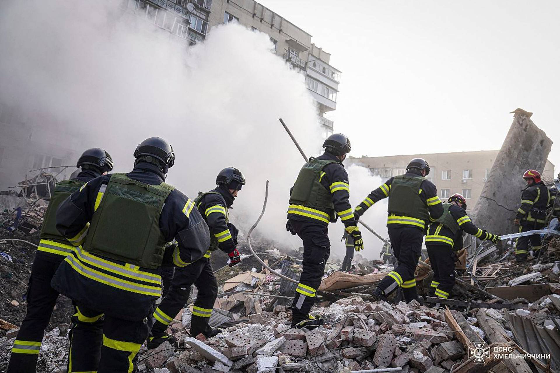 Rescuers work at a site of residential buildings heavily damaged by a Russian missile strike in Khmelnytskyi