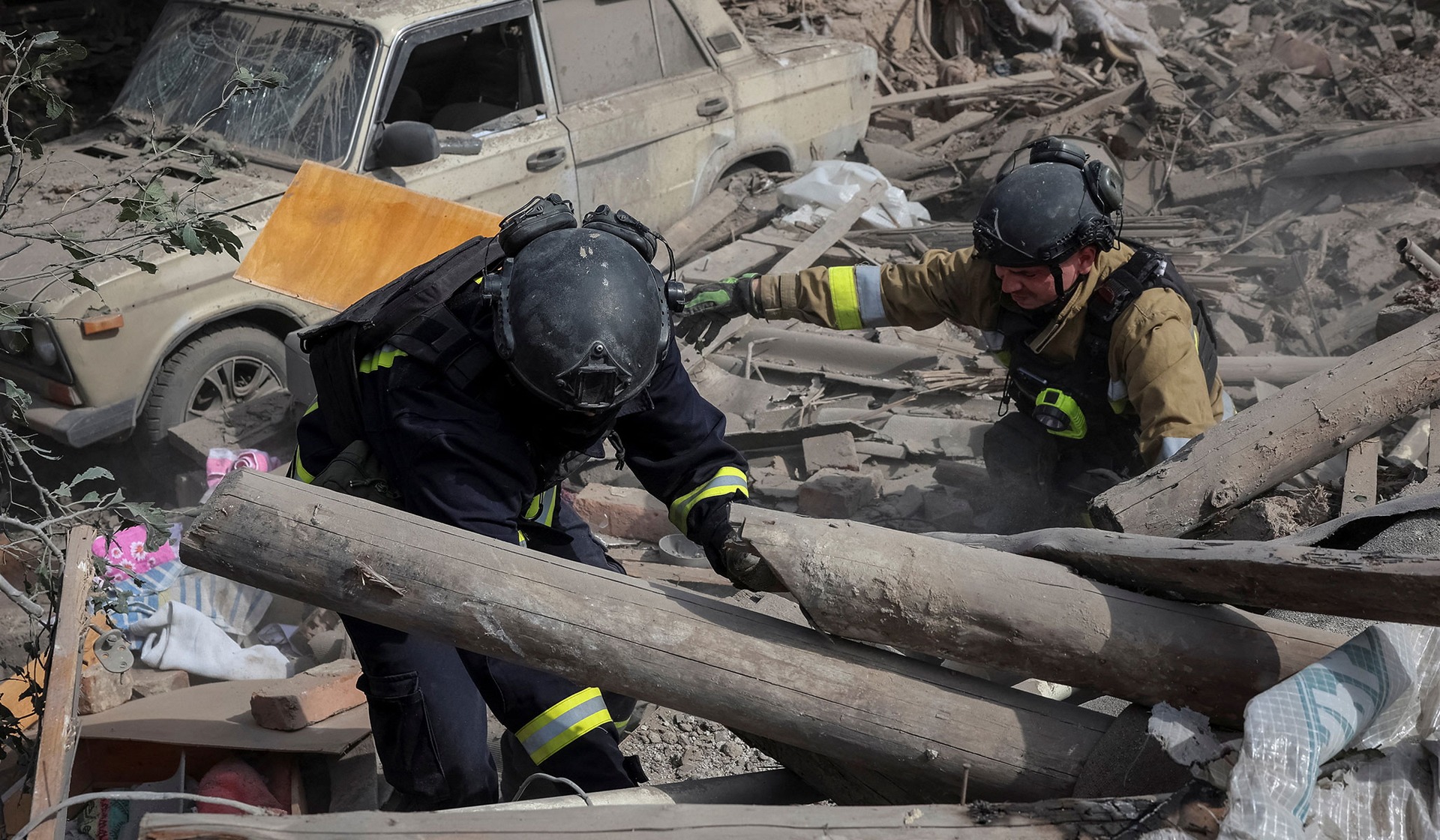 Rescuers work at the site of a private house destroyed during a Russian air strike in the frontline city of Kramatorsk