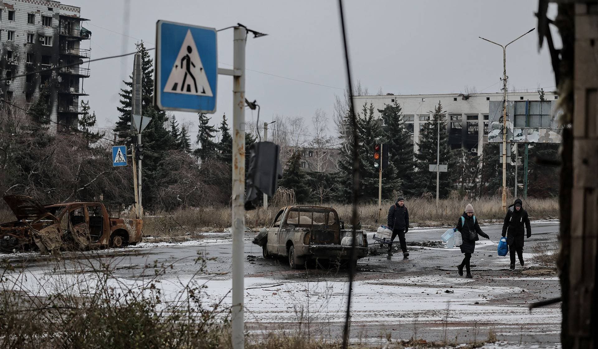 Residents cross a street in the frontline town of Kostiantynivka