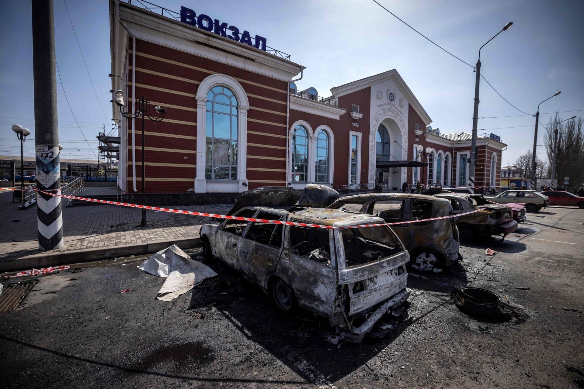 Calcinated cars are pictured outside a train station in Kramatorsk