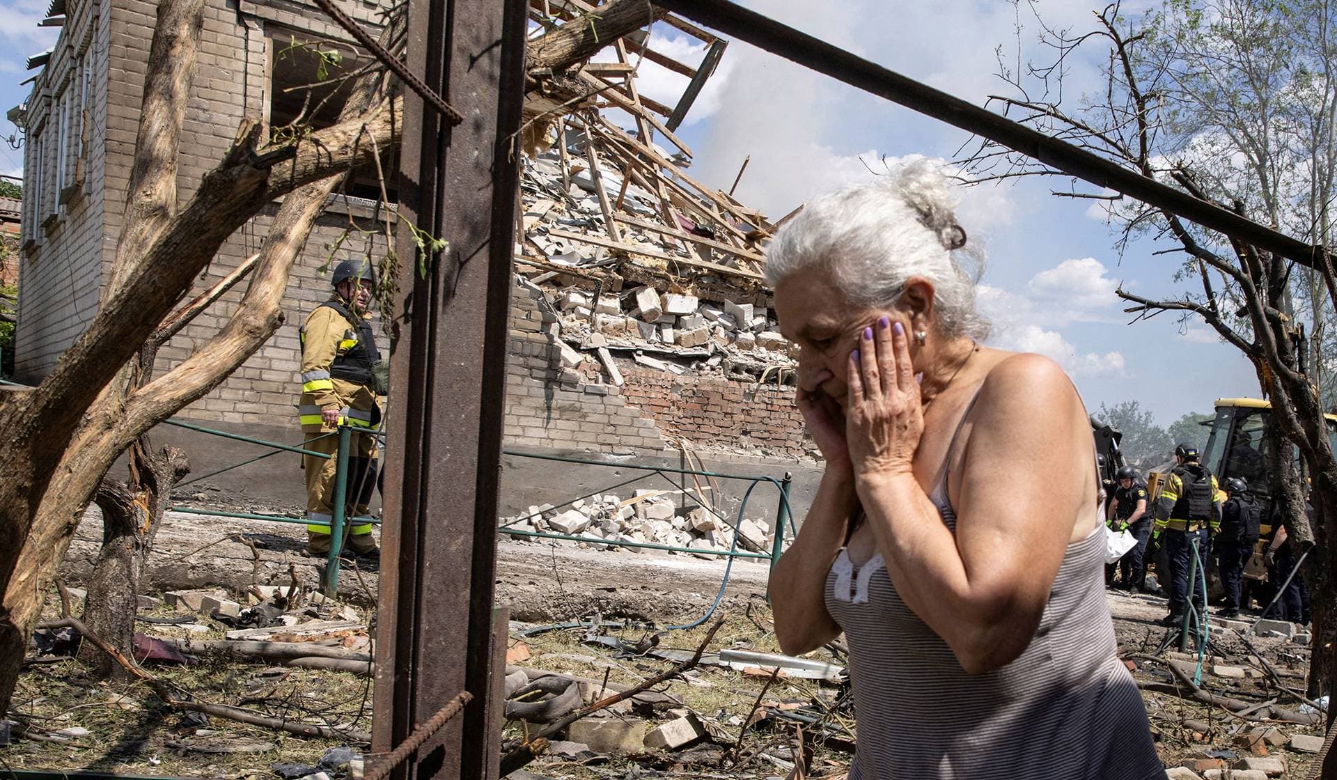 A resident reacts at a site of a house hit by a Russian military strike in Kramatorsk