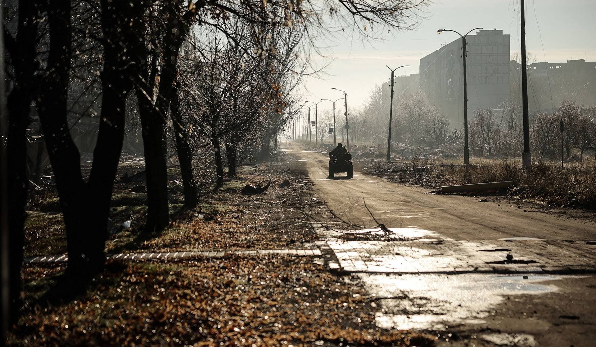 Ukrainian serviceman rides a military buggy in the frontline town of Kostiantynivka