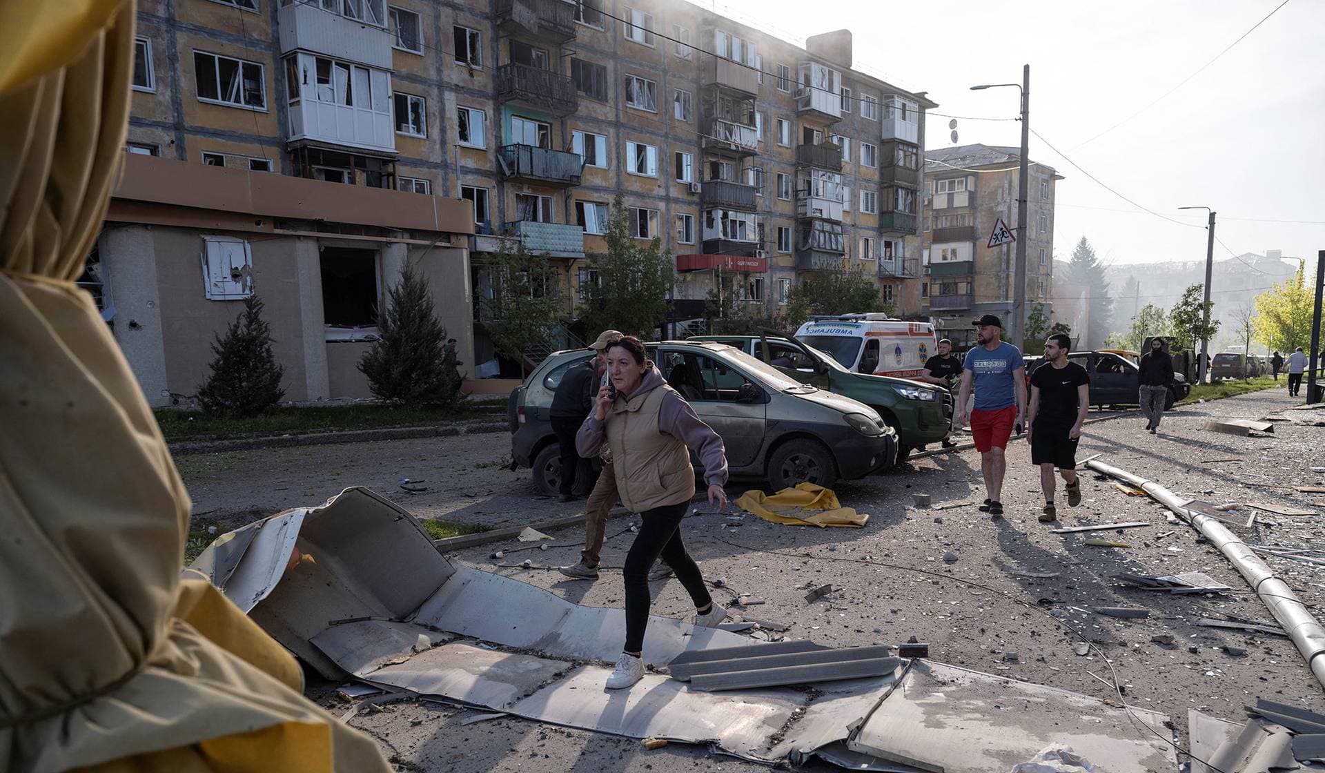 Residents gather at a site of a Russian air strike in the frontline city of Kramatorsk