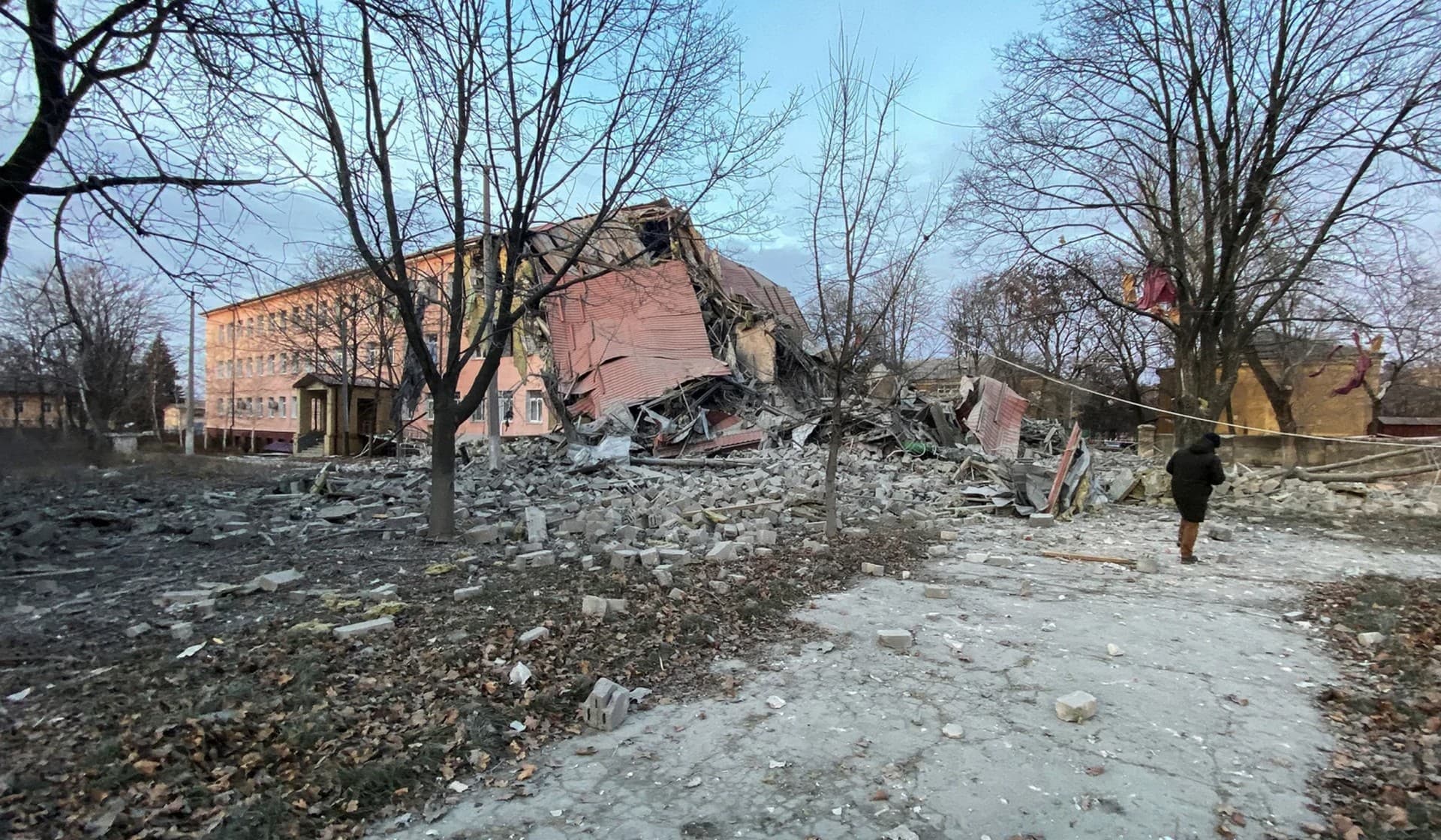 A man at a site of a school building destroyed by a Russian missile strike in Kramatorsk