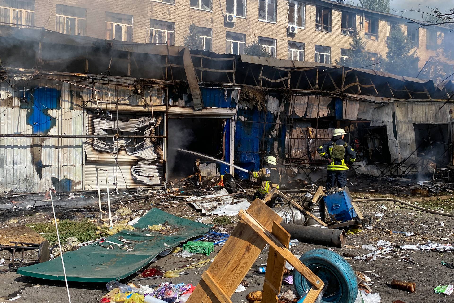 Firefighters extinguish the fire after an attack on the city of Kostiantynivka