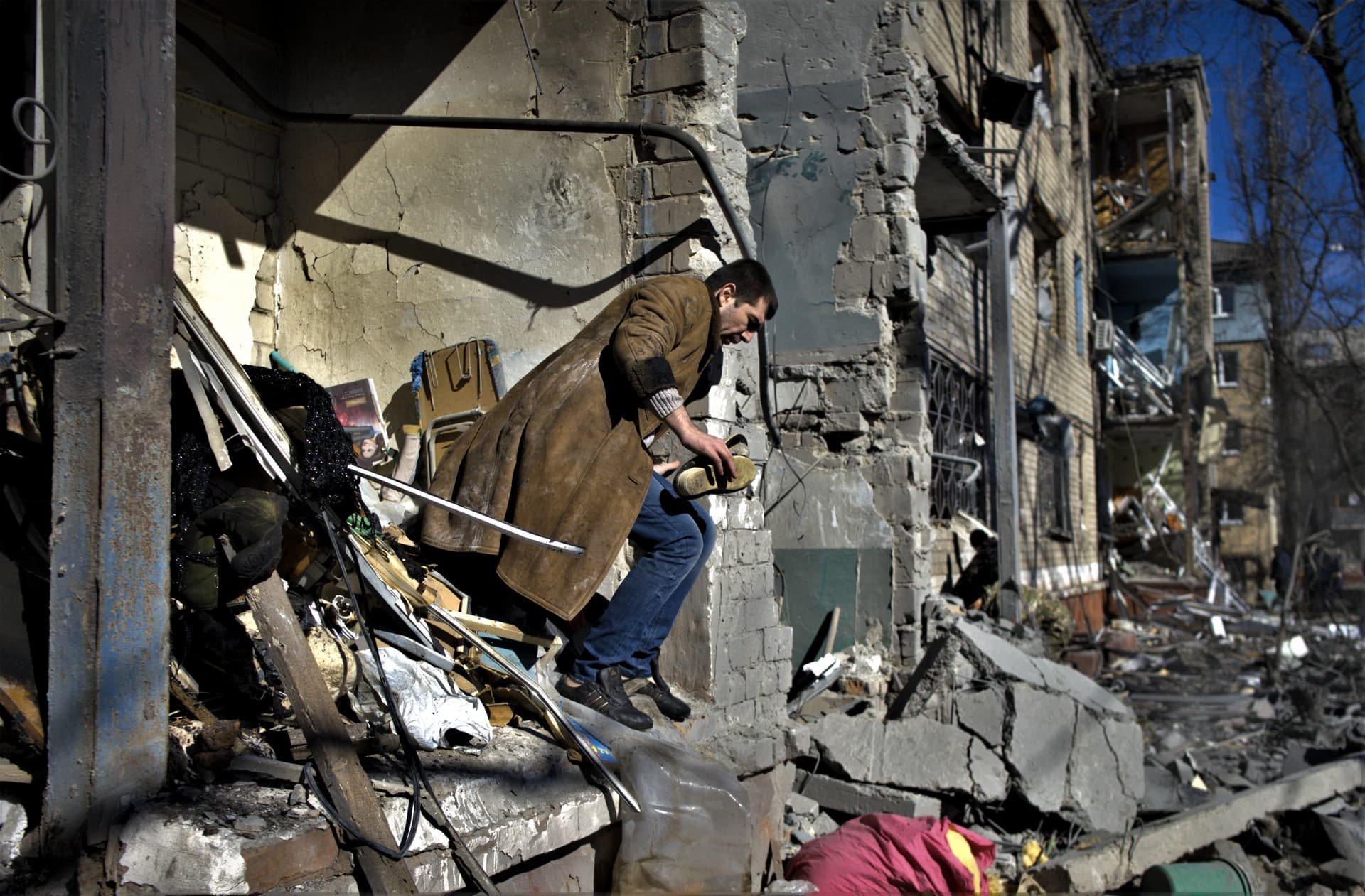 A resident looks for his belongings after Russian shells hit Kramatorsk