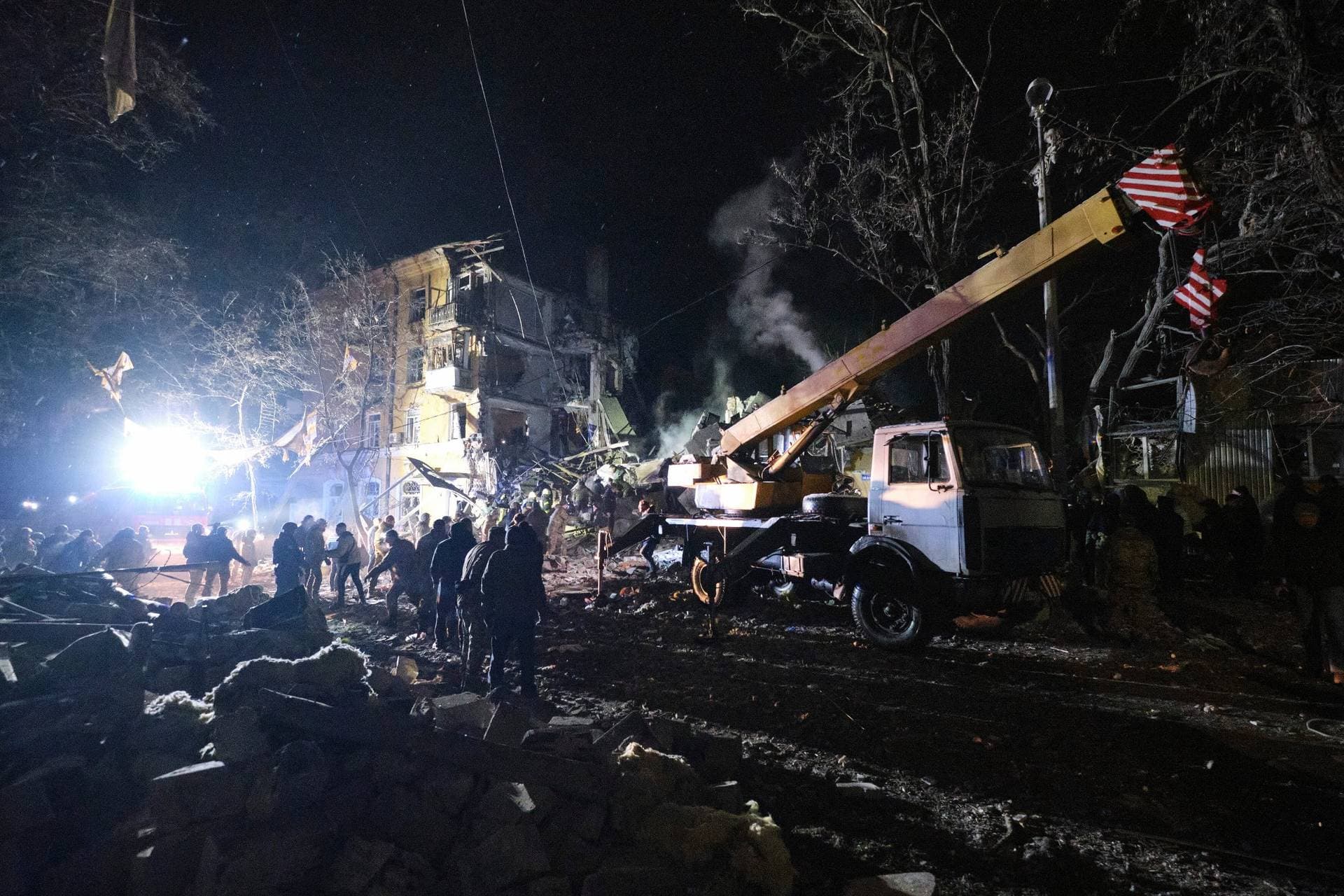 Emergency workers clear the rubble after a Russian rocket hit an apartment building in Kramatorsk