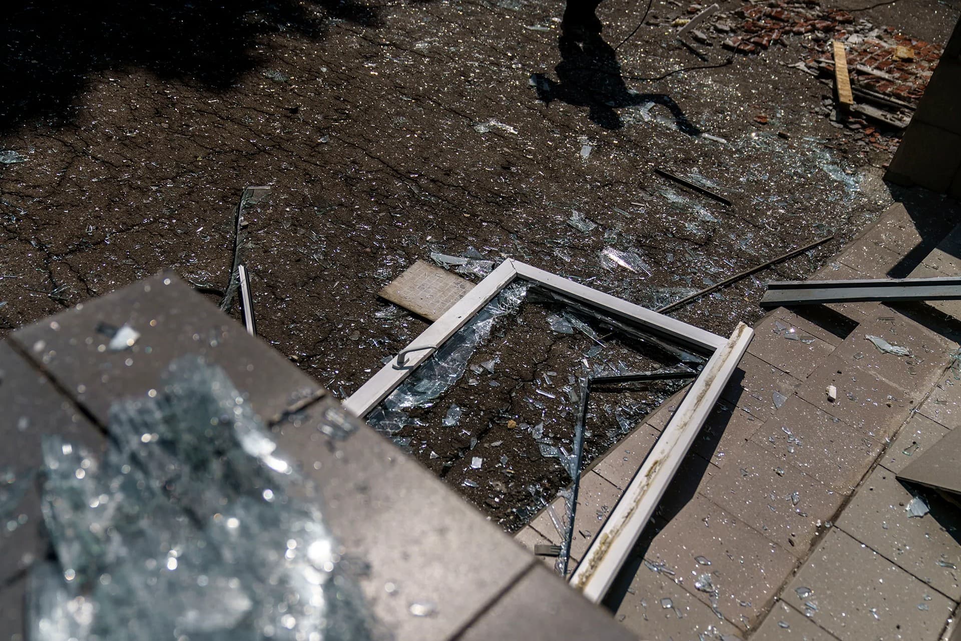 A worker cleans up after an early morning rocket attack hit the Kramatorsk College of Technologies and Design in Kramatorsk