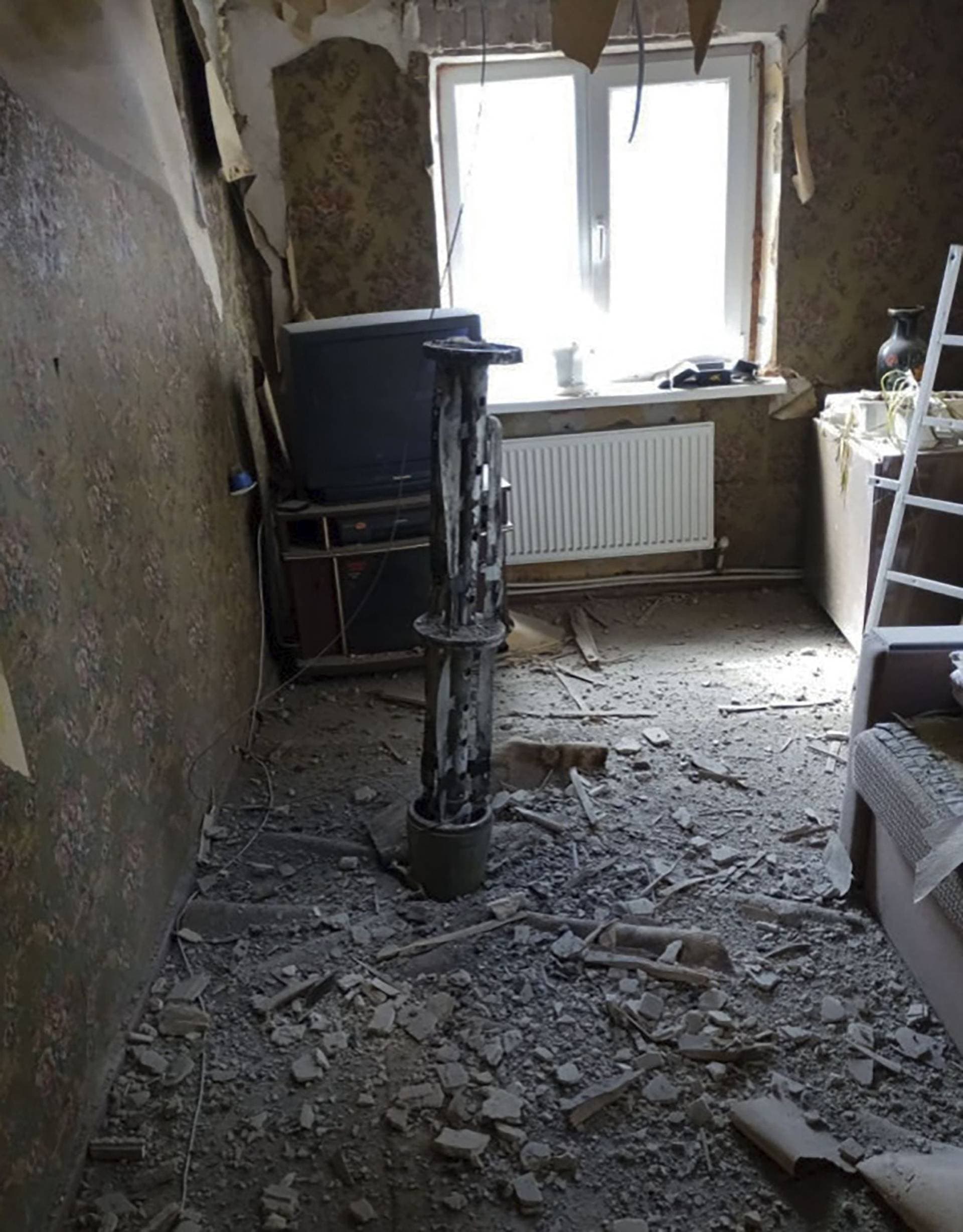 fragments of a Russian missile are seen inside a room of an apartment building in Kostiantynivka