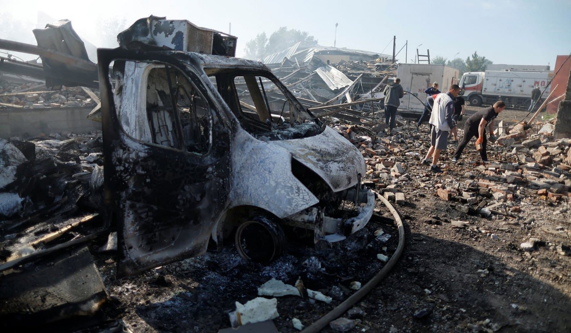Ukrainians remove the consequences of a Russian night strike at a destroyed wholesale market in Kramatorsk