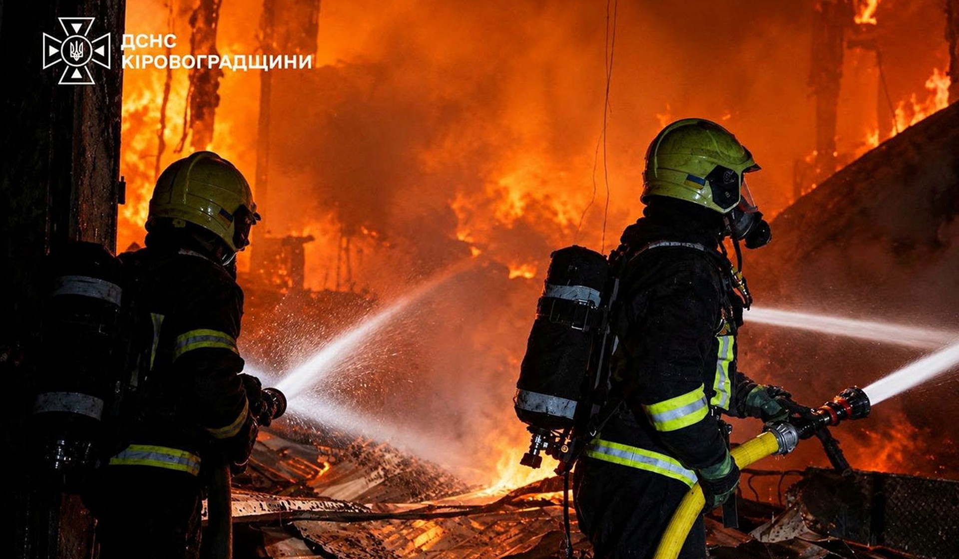 Firefighters work at the site of an enterprise hit by a Russian drone strike in Kropyvnytskyi