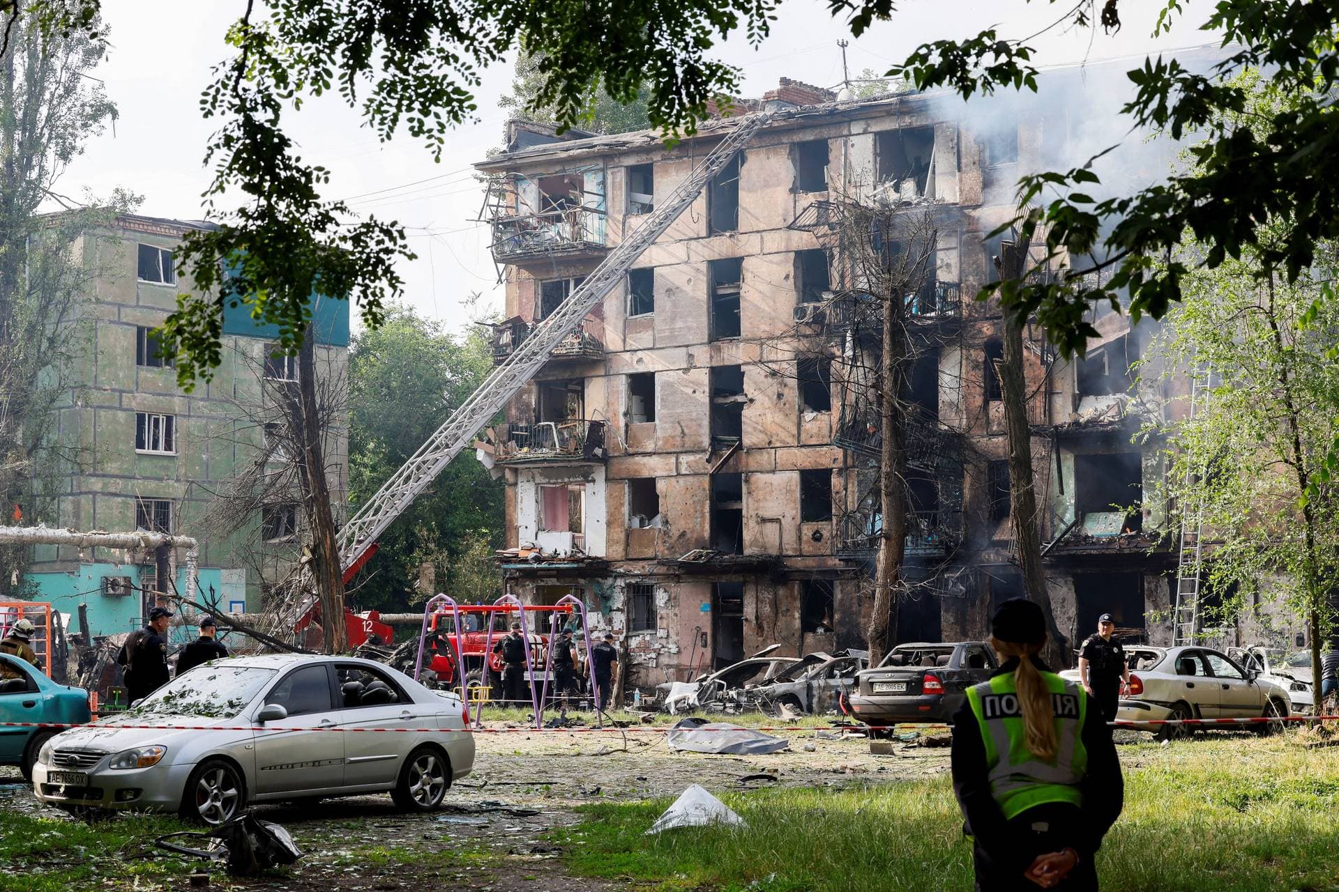 Rescuers work at the site of a residential building heavily damaged by a Russian missile strike in Kryviy Rih 