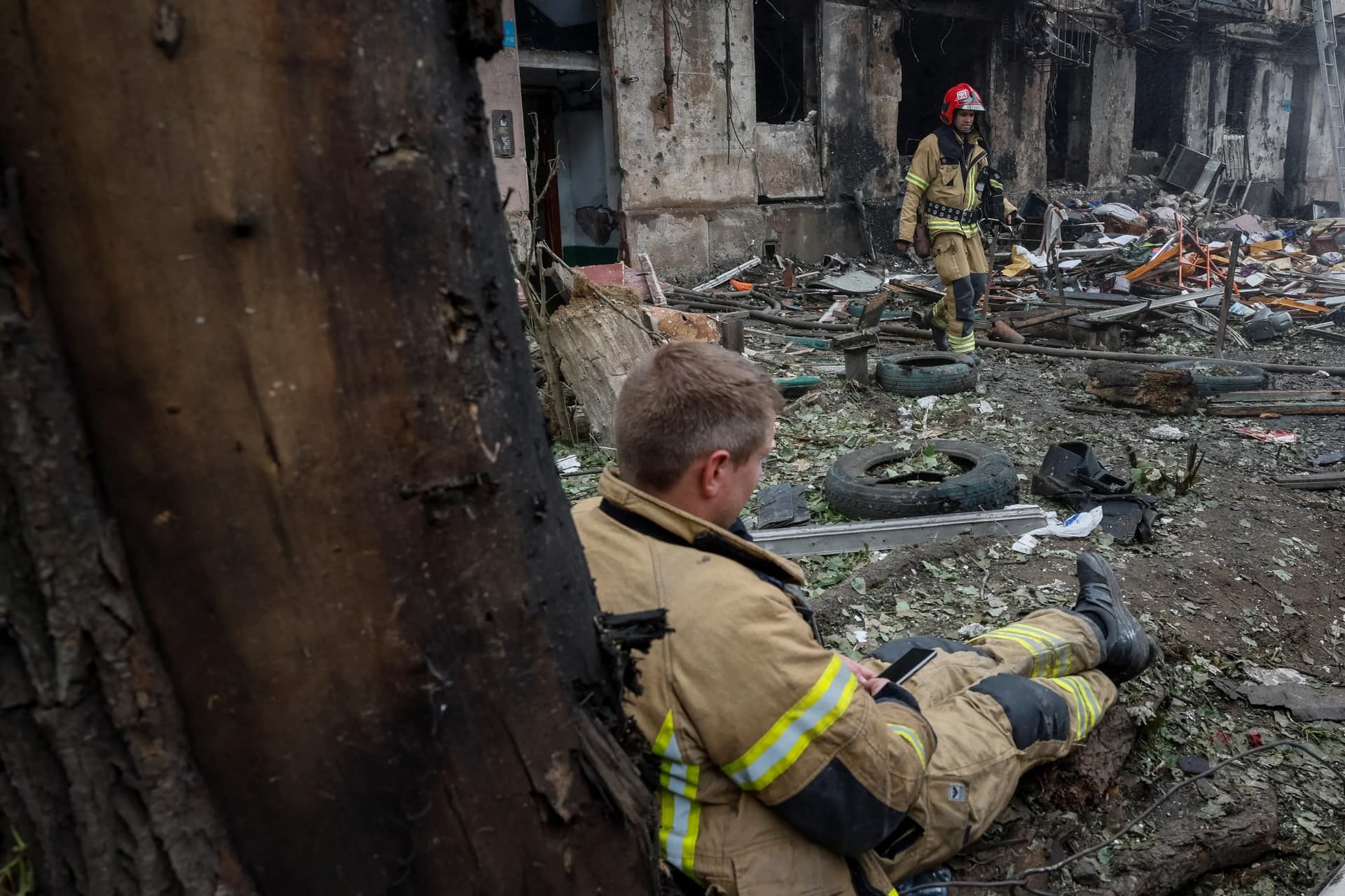 Rescuers work at the site of a residential building heavily damaged by a Russian missile strike in Kryviy Rih 
