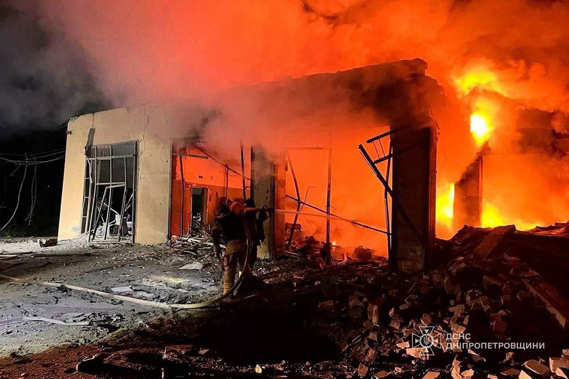 Rescuers work at a site of a Russian missile strike, in Kryvyi Rih