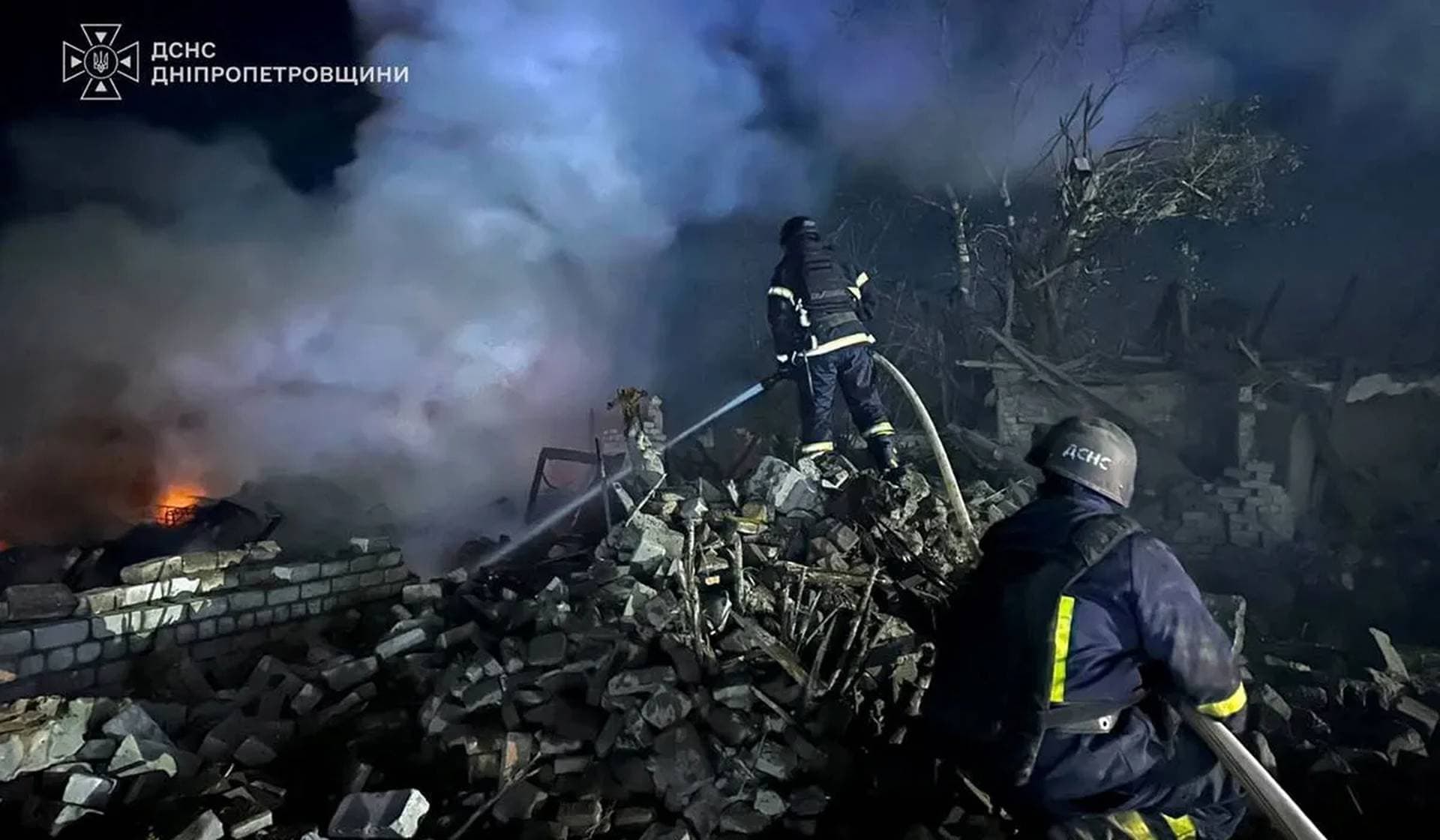 Emergency personnel work following a Russian missile strike at a location given as Kryvyi Rih