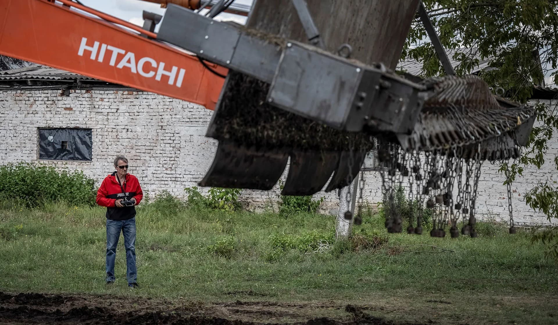 A volunteer tests a demining device near Kryvyi Rih